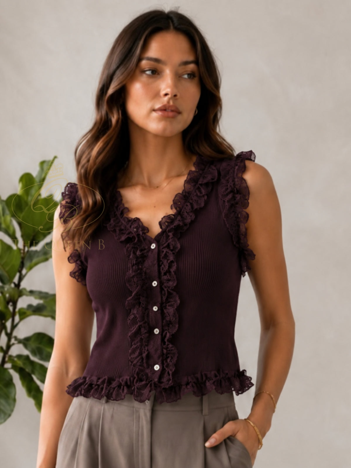QBAW26 LX Lex Top with V-neckline, button front and ruffle detailing around the neckline, armholes and hem.