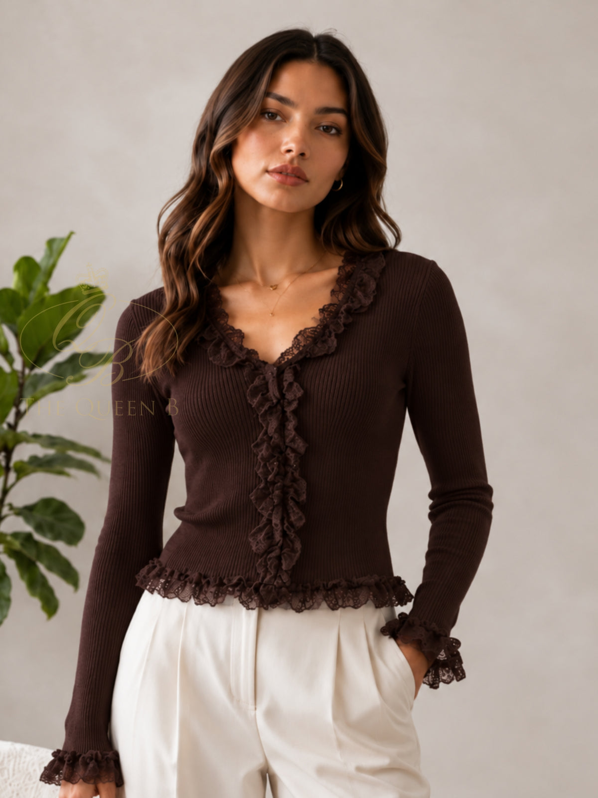 QBAW26 LX Lexy Top with V-neckline, long sleeves and lace ruffle detailing through the front, cuffs and hem.