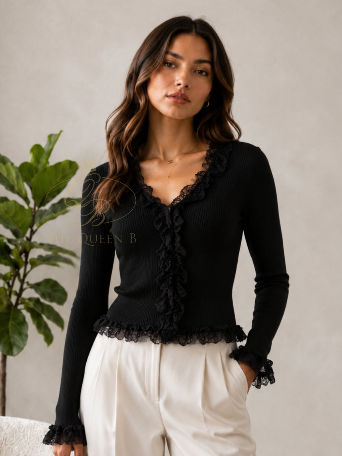 QBAW26 LX Lexy Top with V-neckline, long sleeves and lace ruffle detailing through the front, cuffs and hem.
