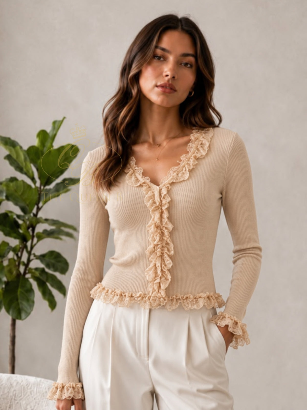 QBAW26 LX Lexy Top with V-neckline, long sleeves and lace ruffle detailing through the front, cuffs and hem.