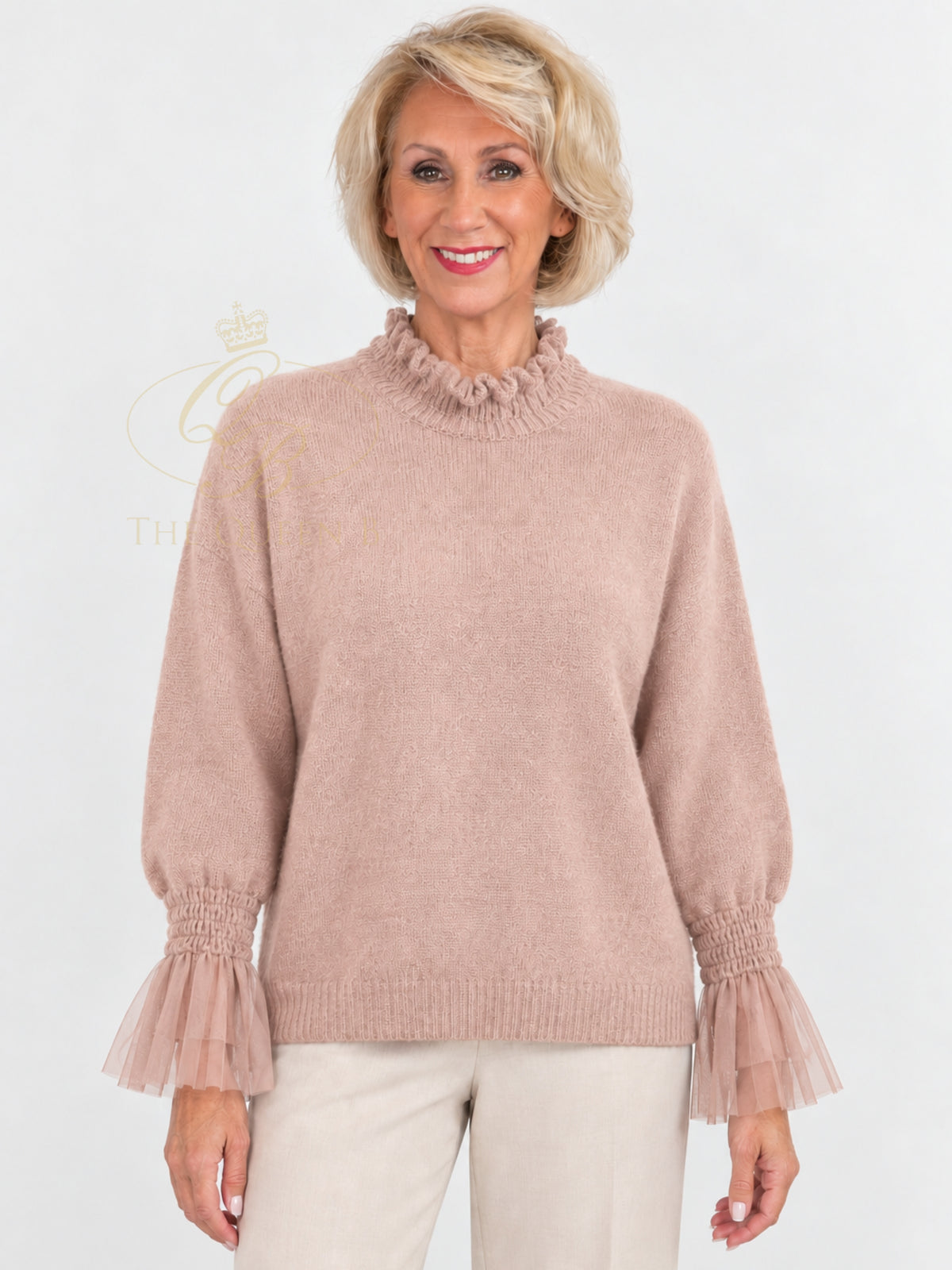 QBAW26 LX Poppy Jumper with ruffle high neckline, long balloon sleeves, sheer ruffle cuffs and ribbed hem.