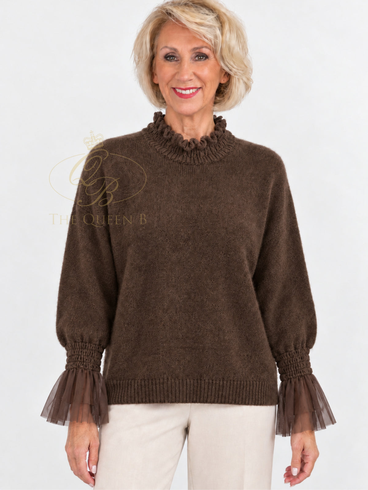 QBAW26 LX Poppy Jumper with ruffle high neckline, long balloon sleeves, sheer ruffle cuffs and ribbed hem.
