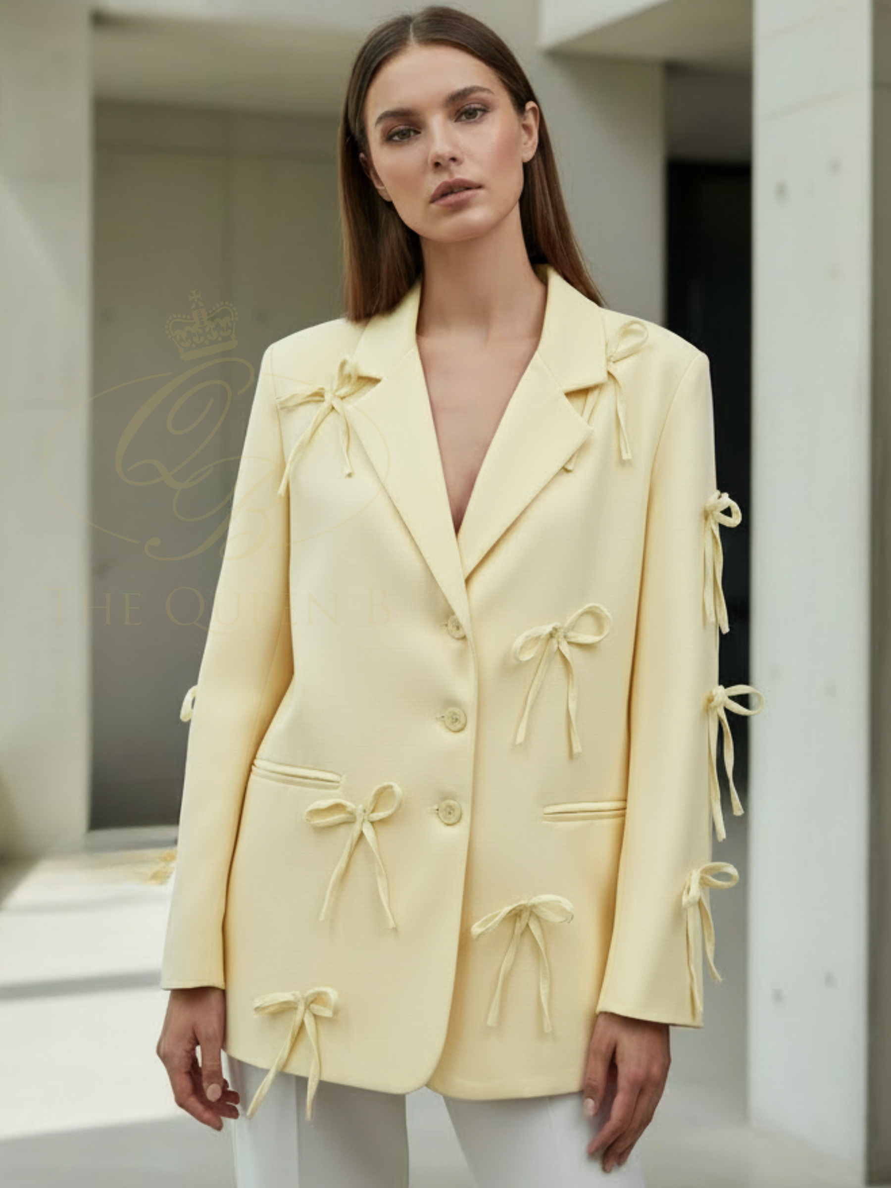 QBSS26 UA Jasmine Bow Blazer with tailored silhouette, bow detailing and classic lapel neckline, styled for an elegant finish.