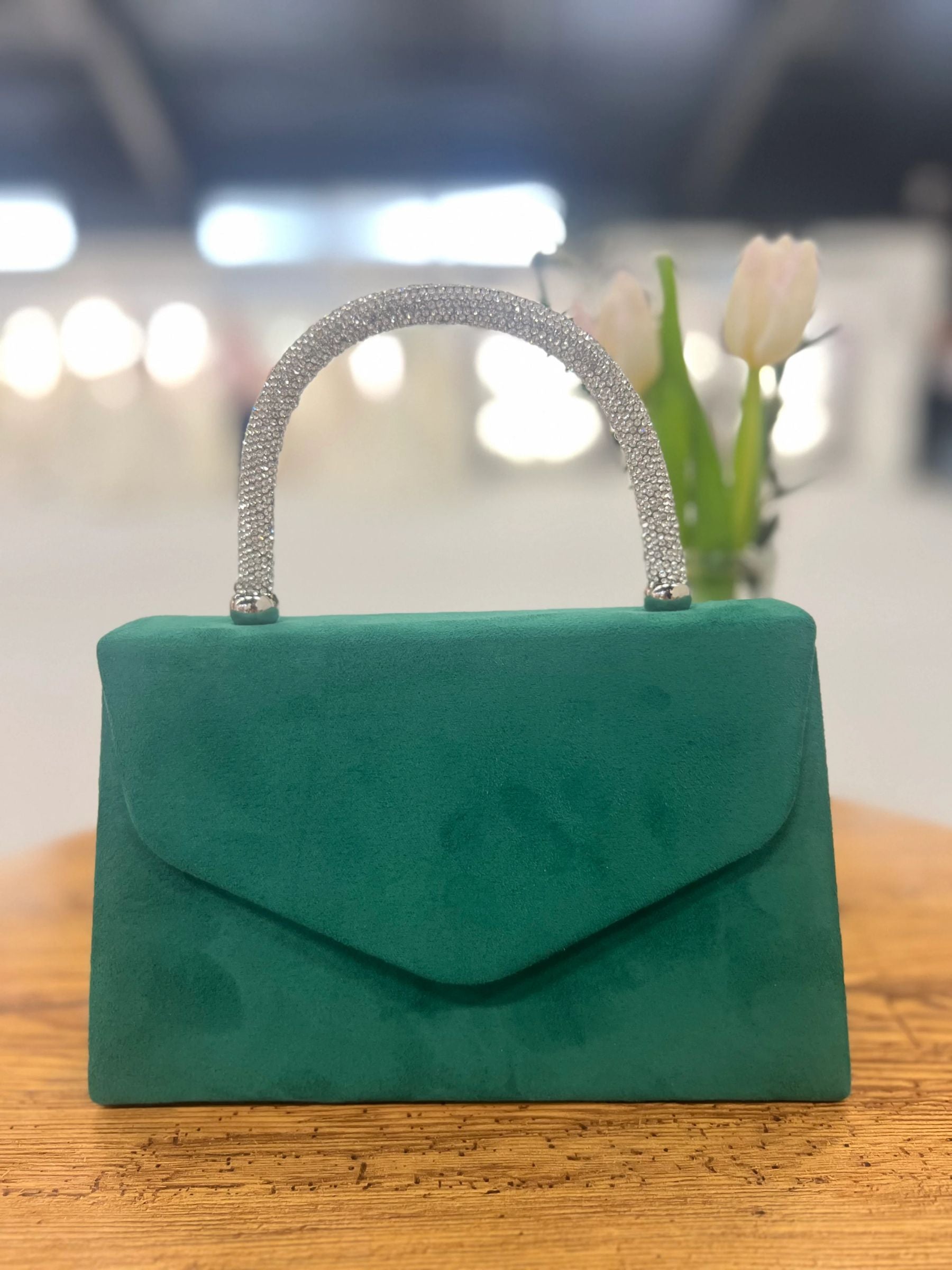 Green structured handbag with sparkling rhinestone handle - elegant women’s evening bag for weddings, parties and chic occasionwear.
