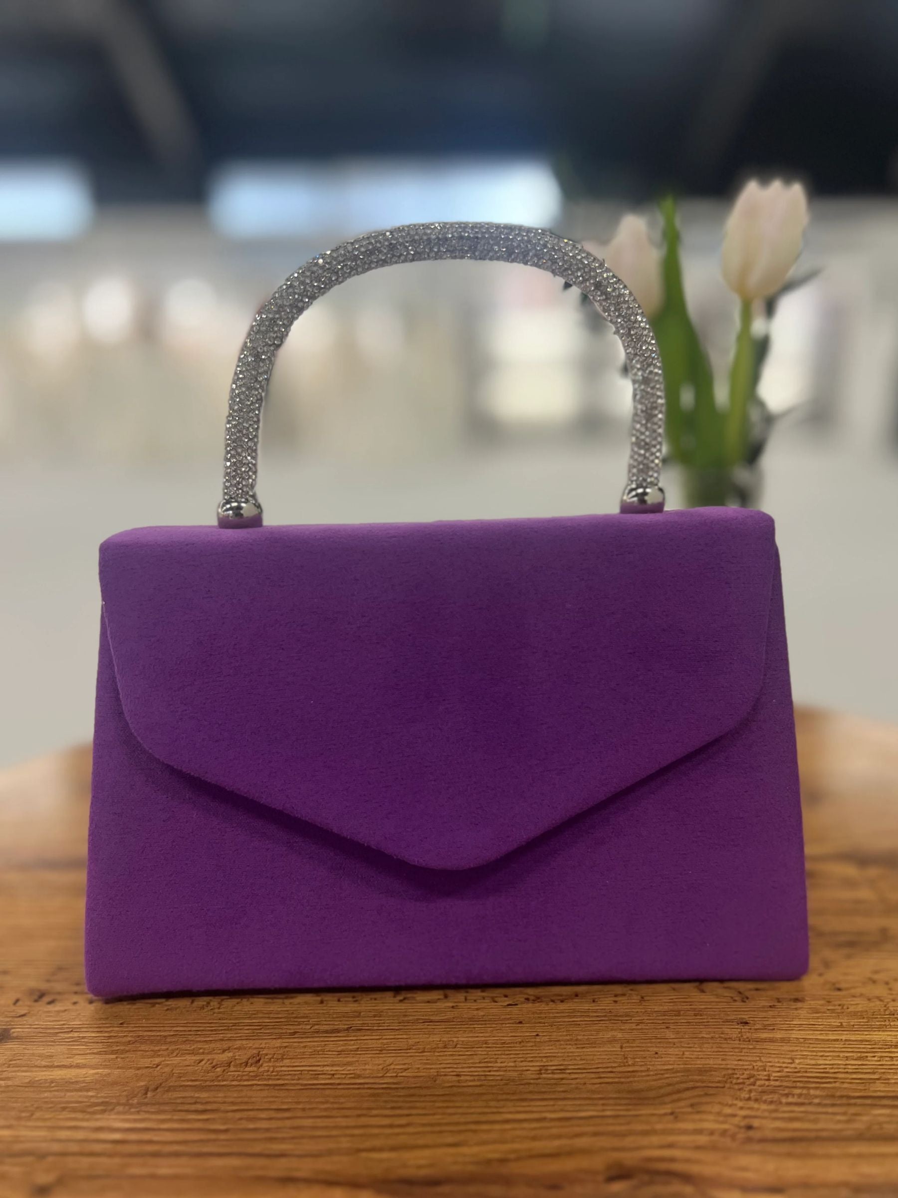 Purple structured handbag with sparkling rhinestone handle - elegant women’s evening bag for weddings, parties and chic occasionwear.
