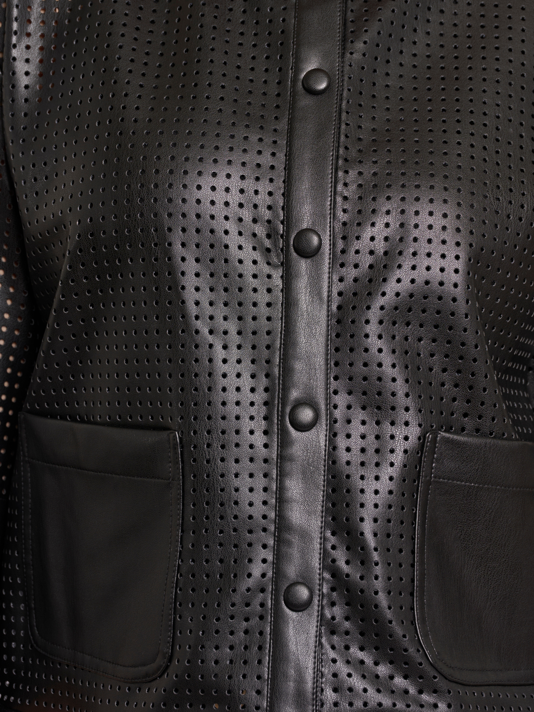 Rino & Pelle Abou Jacket with perforated faux leather design, cropped structured silhouette and modern button front.