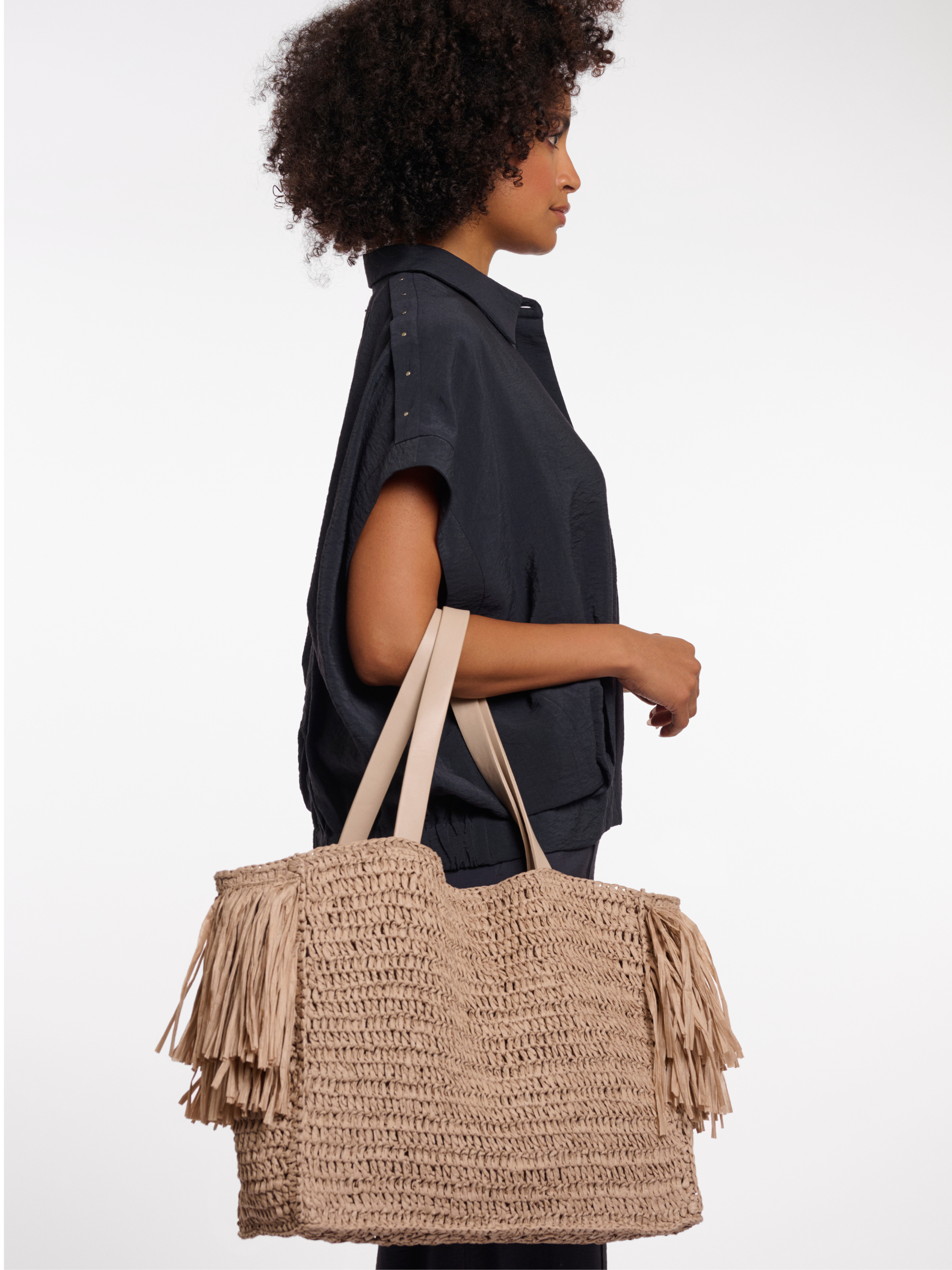 Rino & Pelle Carlijn Beachbag woven tote bag with fringe trim and structured silhouette.