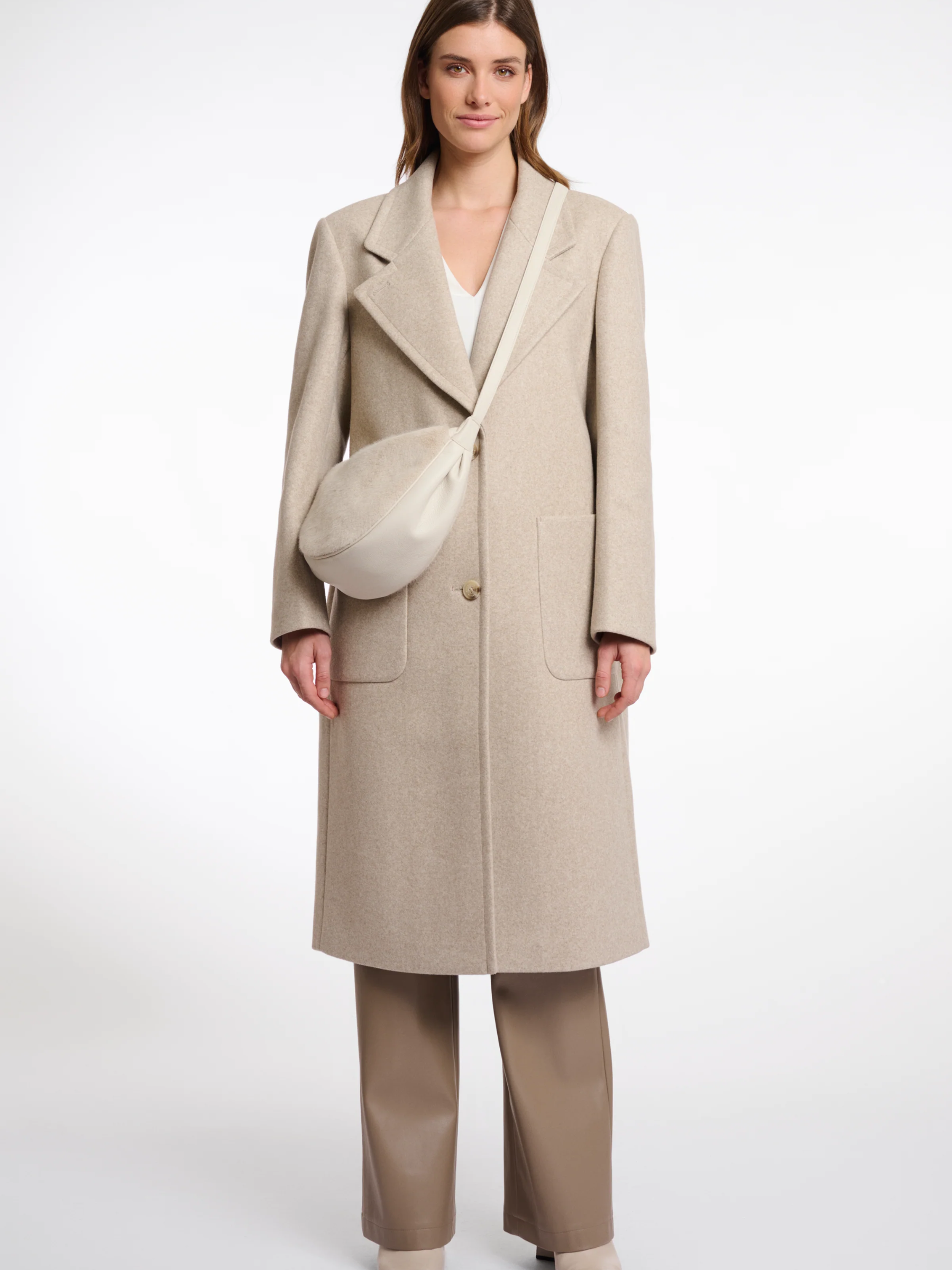 Rino & Pelle Dalina Birch Mini Crossbody Bag – women’s beige crossbody bag with adjustable strap, compact design and minimalist chic style for everyday wear.