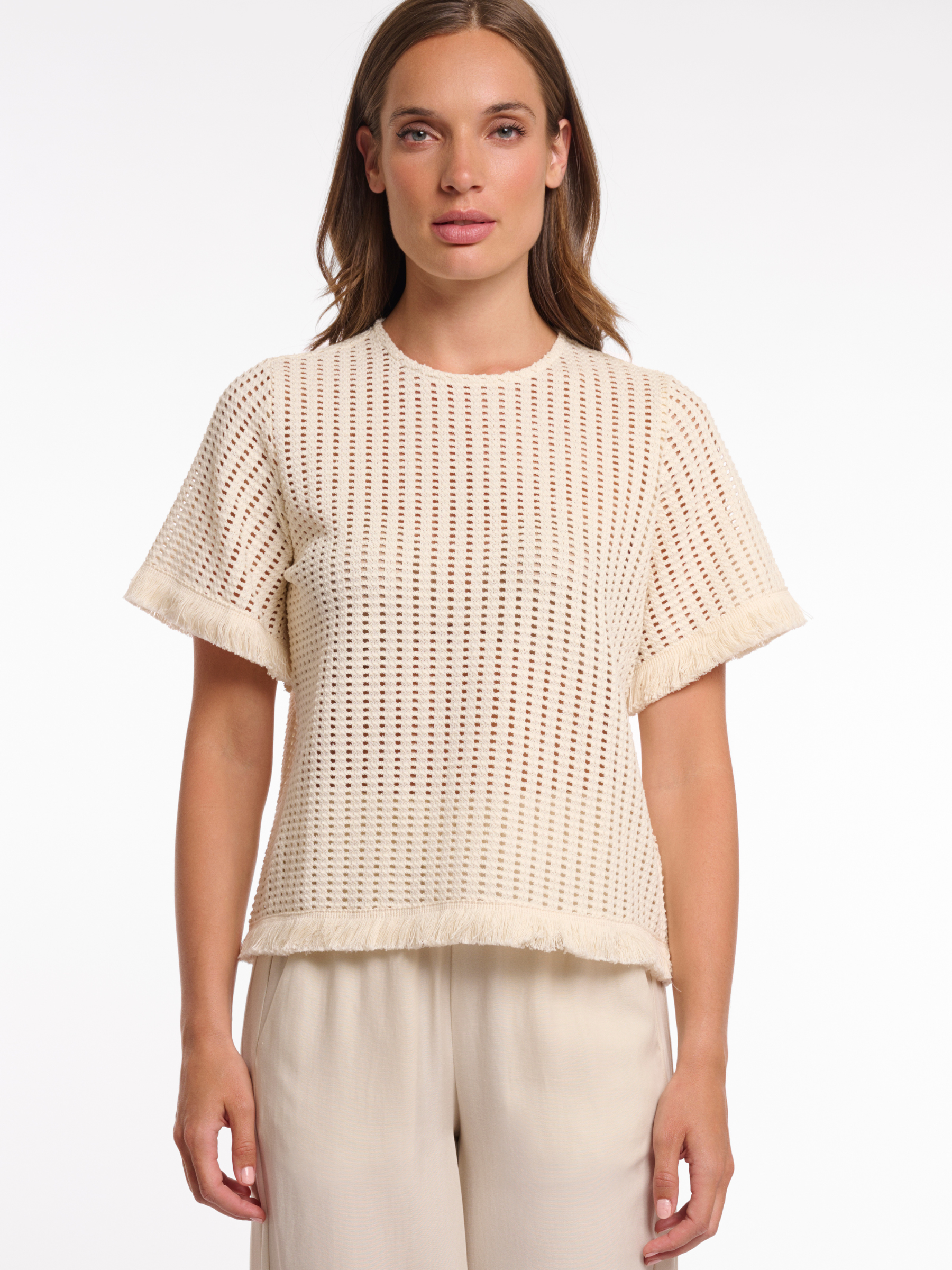 Rino & Pelle Flora Top open knit short sleeve top with fringe trim and round neckline.