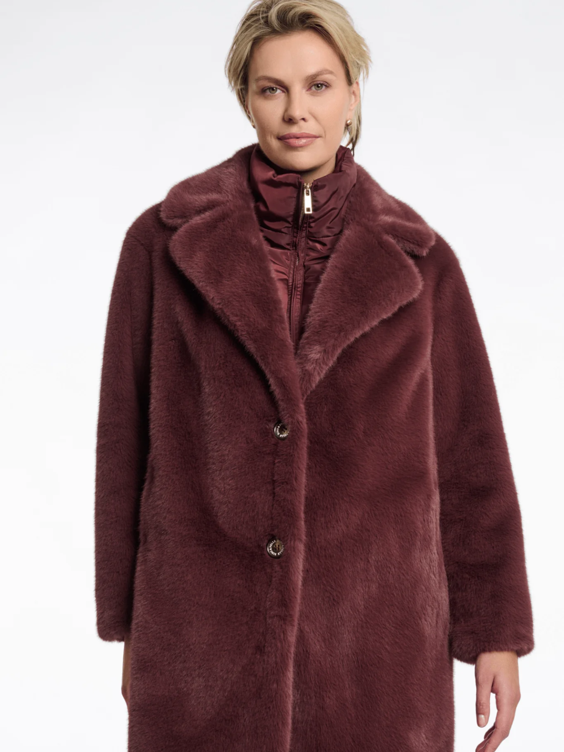 Rino & Pelle Geesje Chocolate Bean faux fur coat with zip inner layer-luxury women’s longline winter coat for stylish cold-weather outfits.