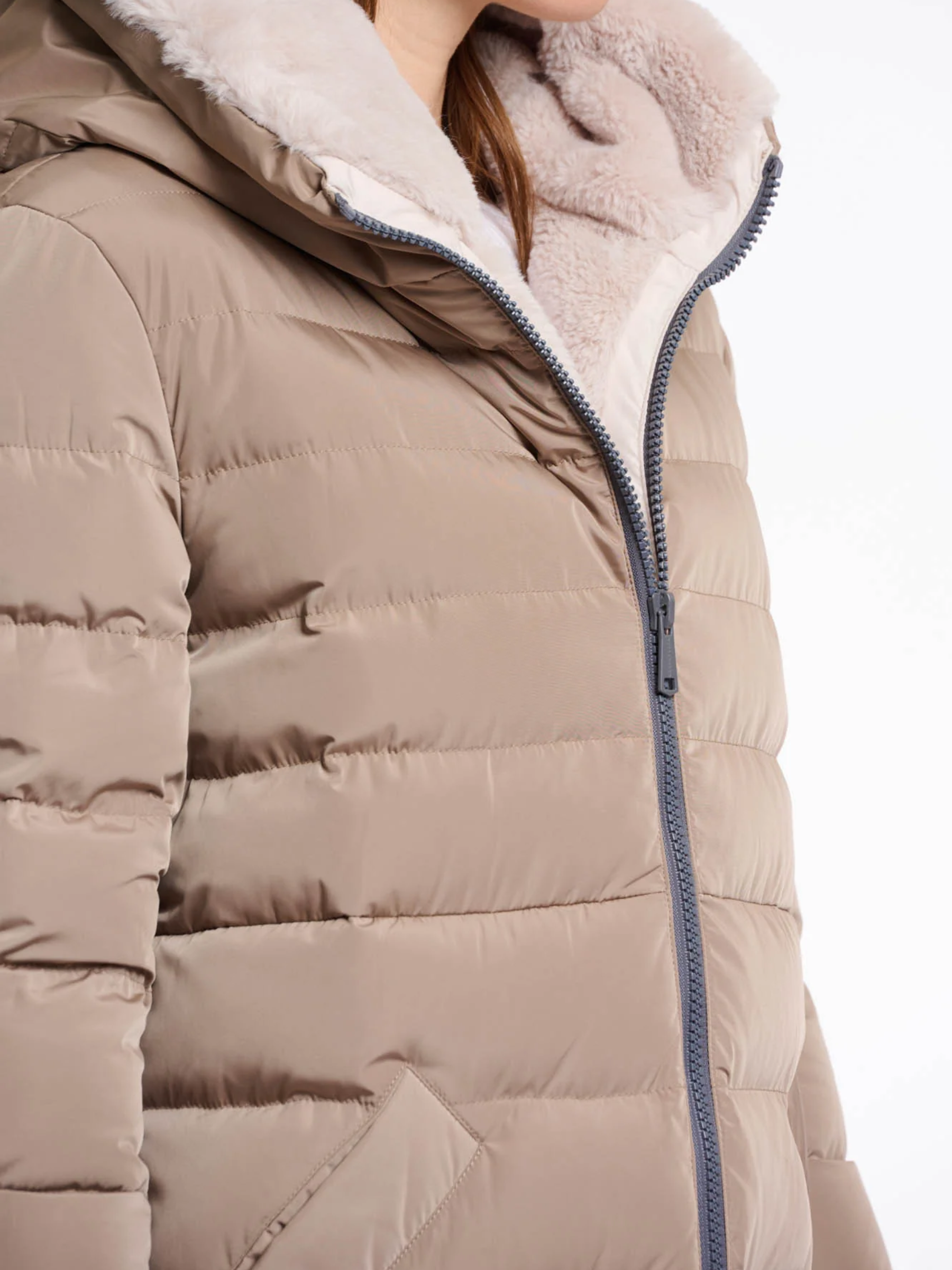 Rino & Pelle Keilafur long padded winter coat for women with faux-fur lining, hood, zip closure and side zips – stylish insulated outerwear for cold weather.