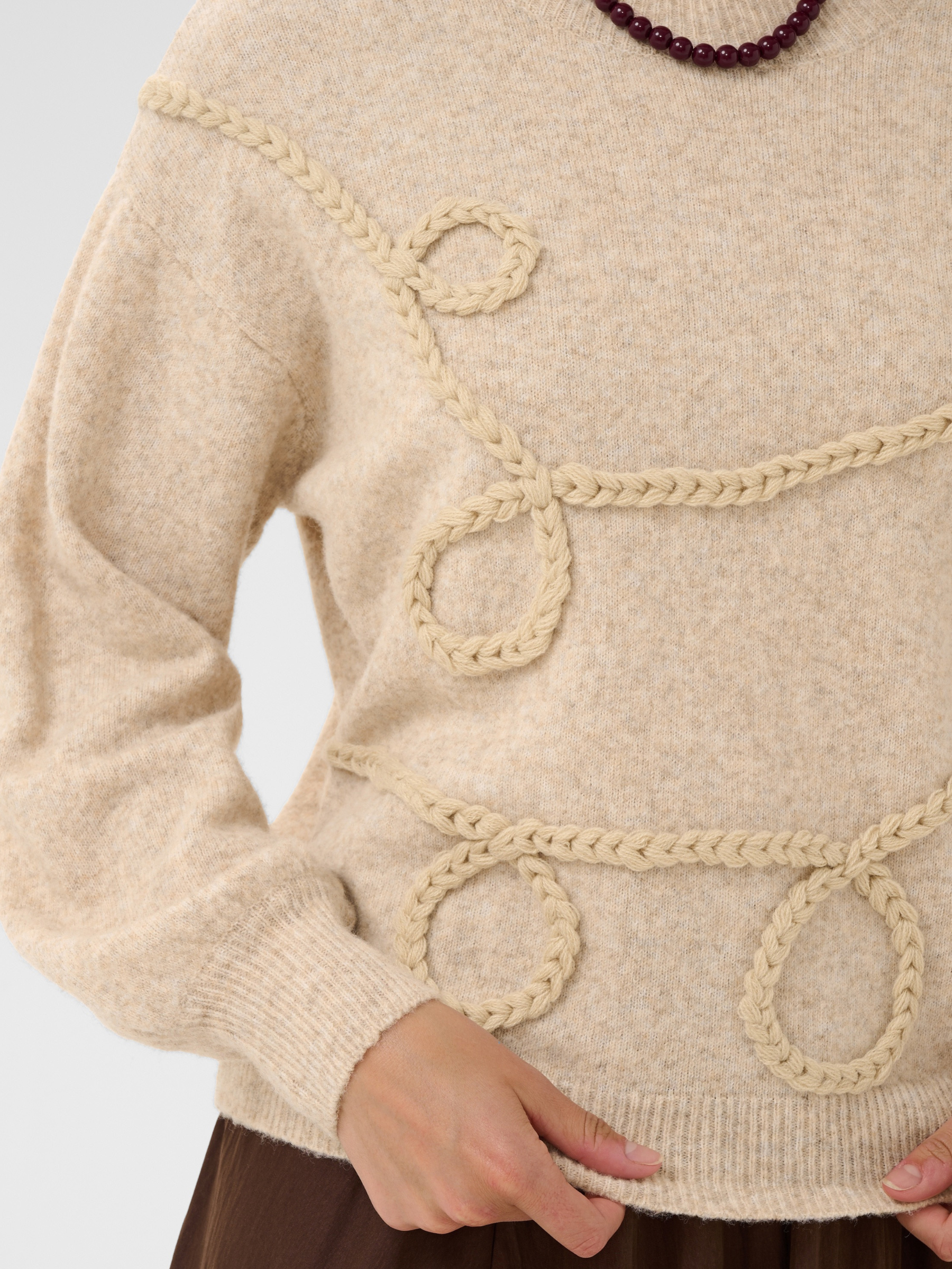 Saint Tropez Titia Pullover with round neckline, long sleeves, loose fit and textured braided front detailing