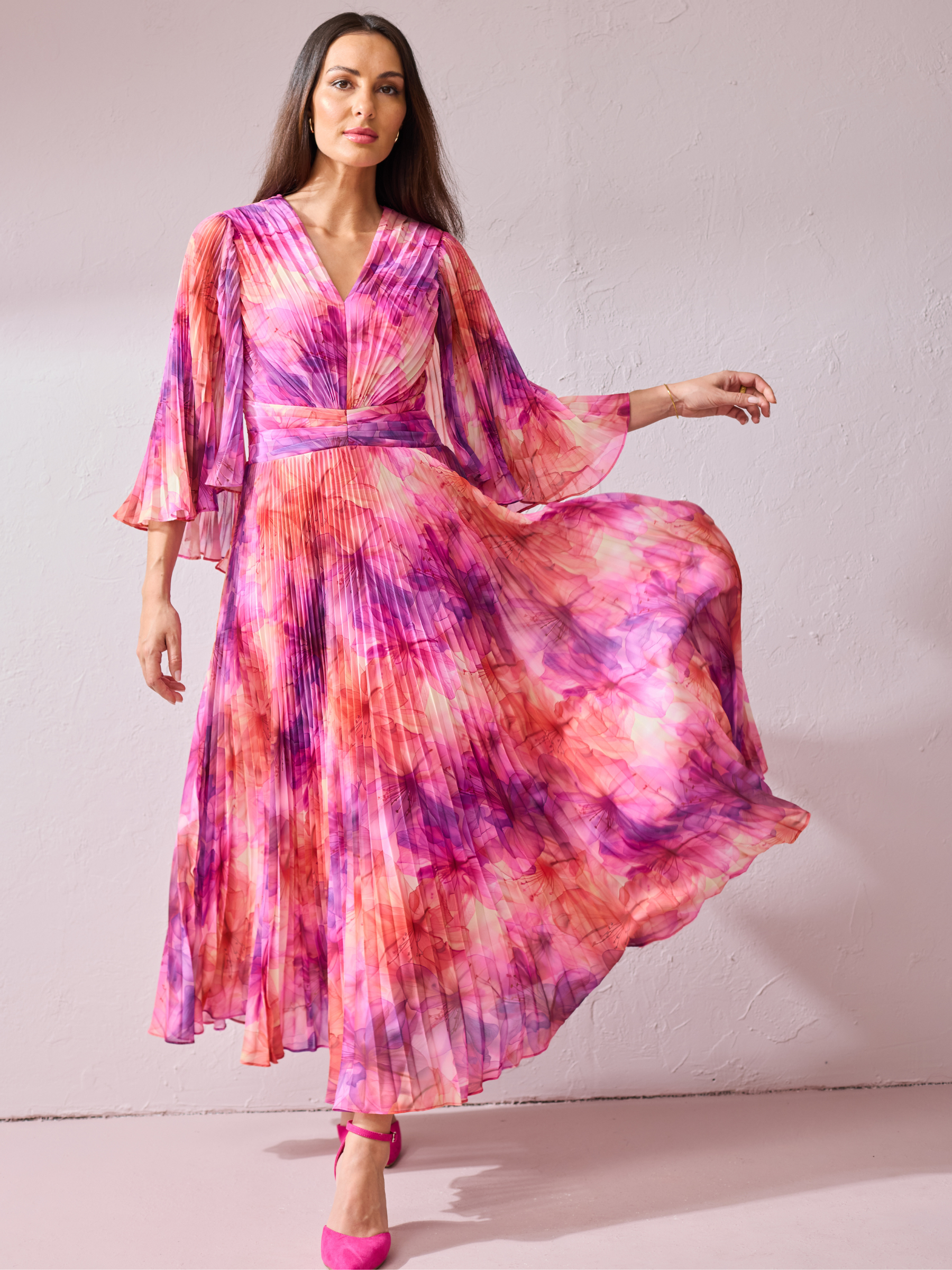 Samantha Jane Alice Pink Print Dress with pleated maxi skirt, wrap-style bodice and flowing silhouette.