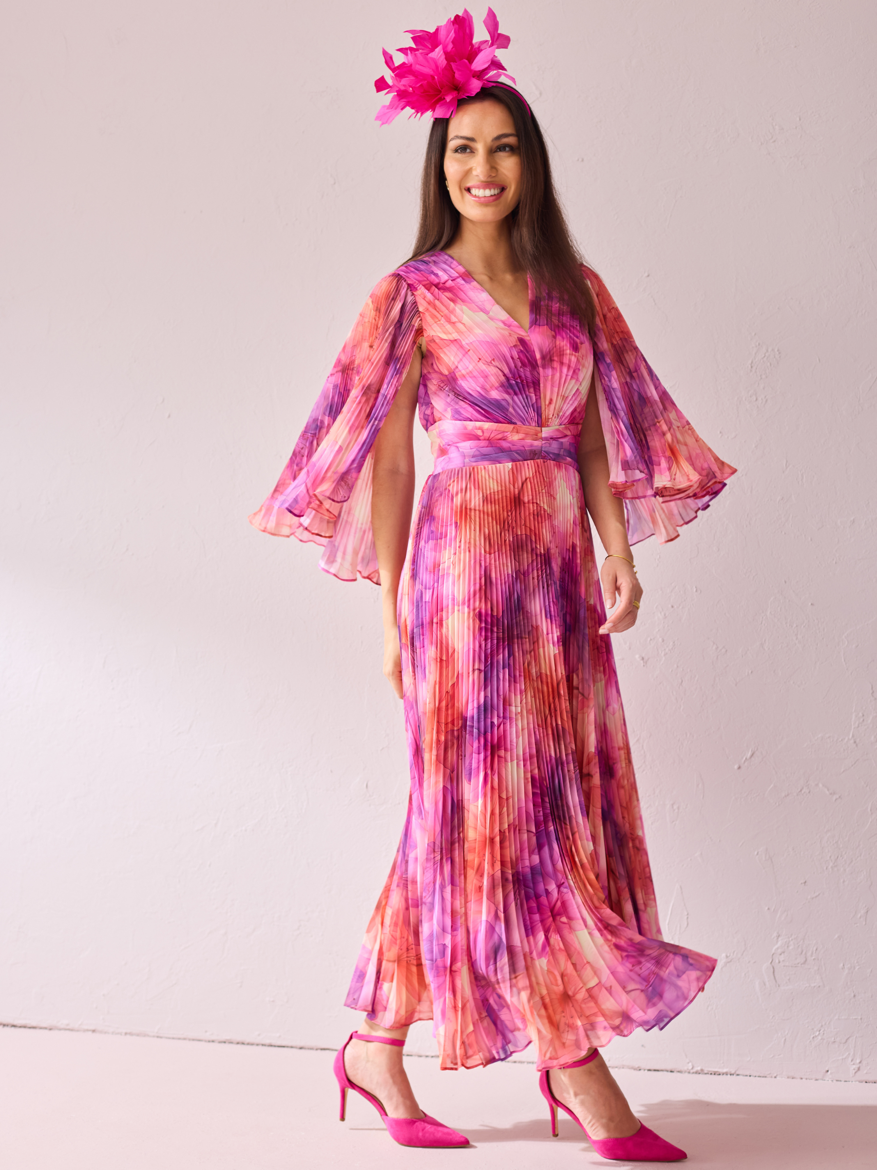 Samantha Jane Alice Pink Print Dress with pleated maxi skirt, wrap-style bodice and flowing silhouette.