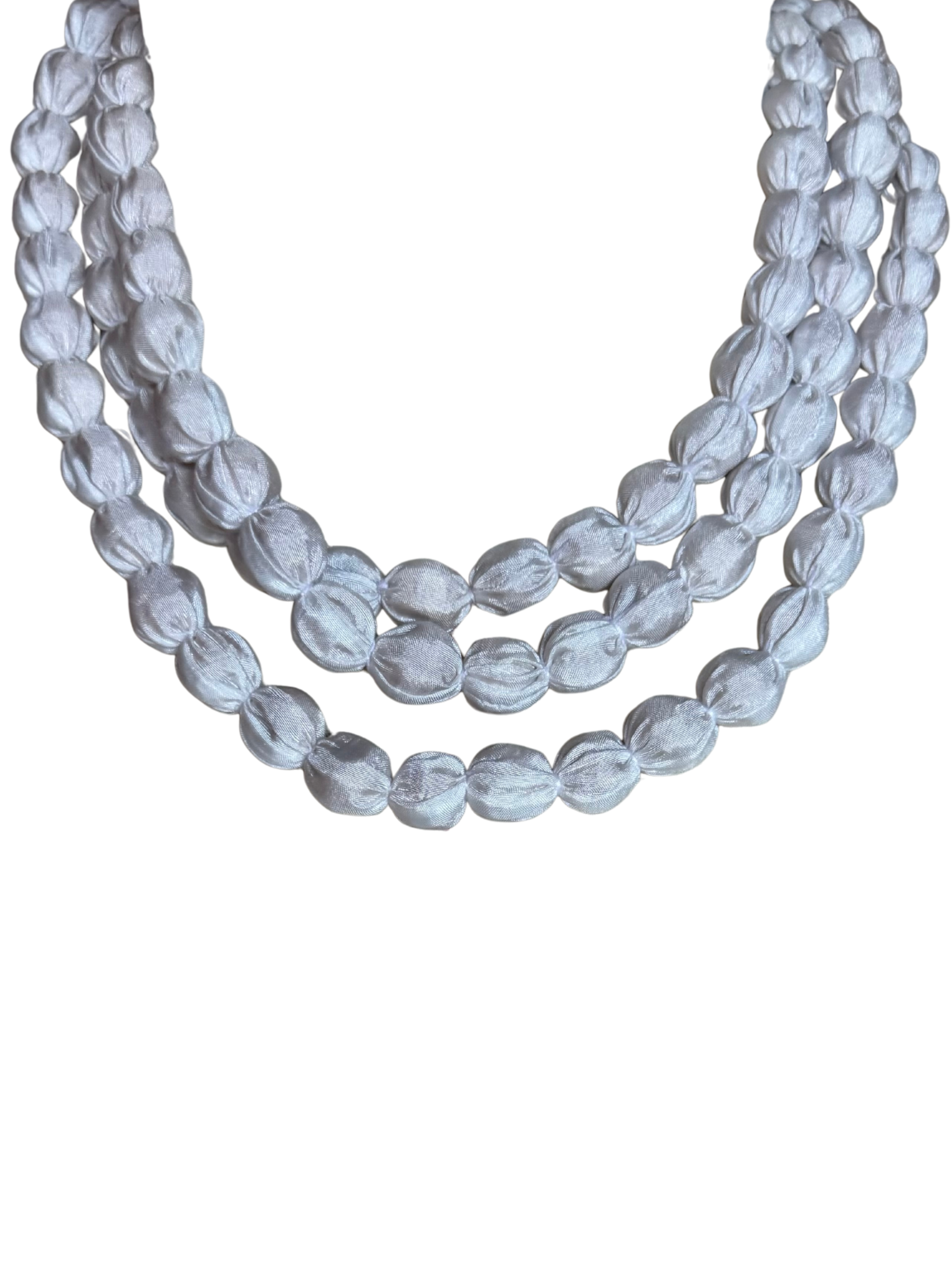 Tara Vao N09 Necklace with layered strands of fabric-wrapped beads creating a soft textured statement necklace.
