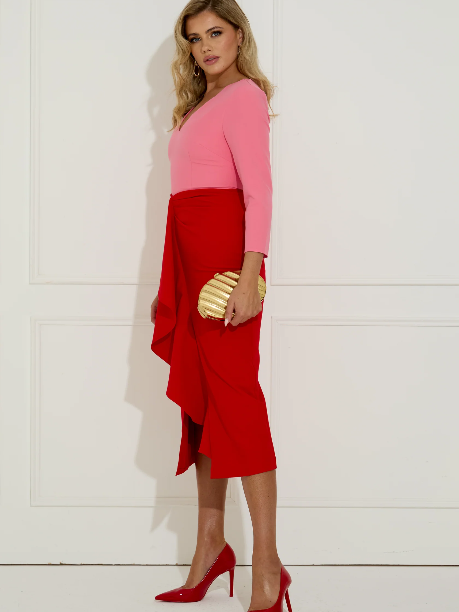 The 8th Sign 8SAW709 Red/Pink Carmen Colourblock Midi Dress colourblock midi dress with V-neckline, long sleeves, fitted waist and elegant occasion silhouette.