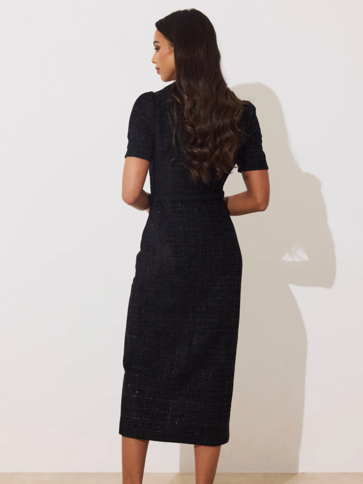 The 8th Sign Harriet Sparkle Tweed Midi Dress with sweetheart neckline, short sleeves, updated gold button-front detail, waist belt and front split.