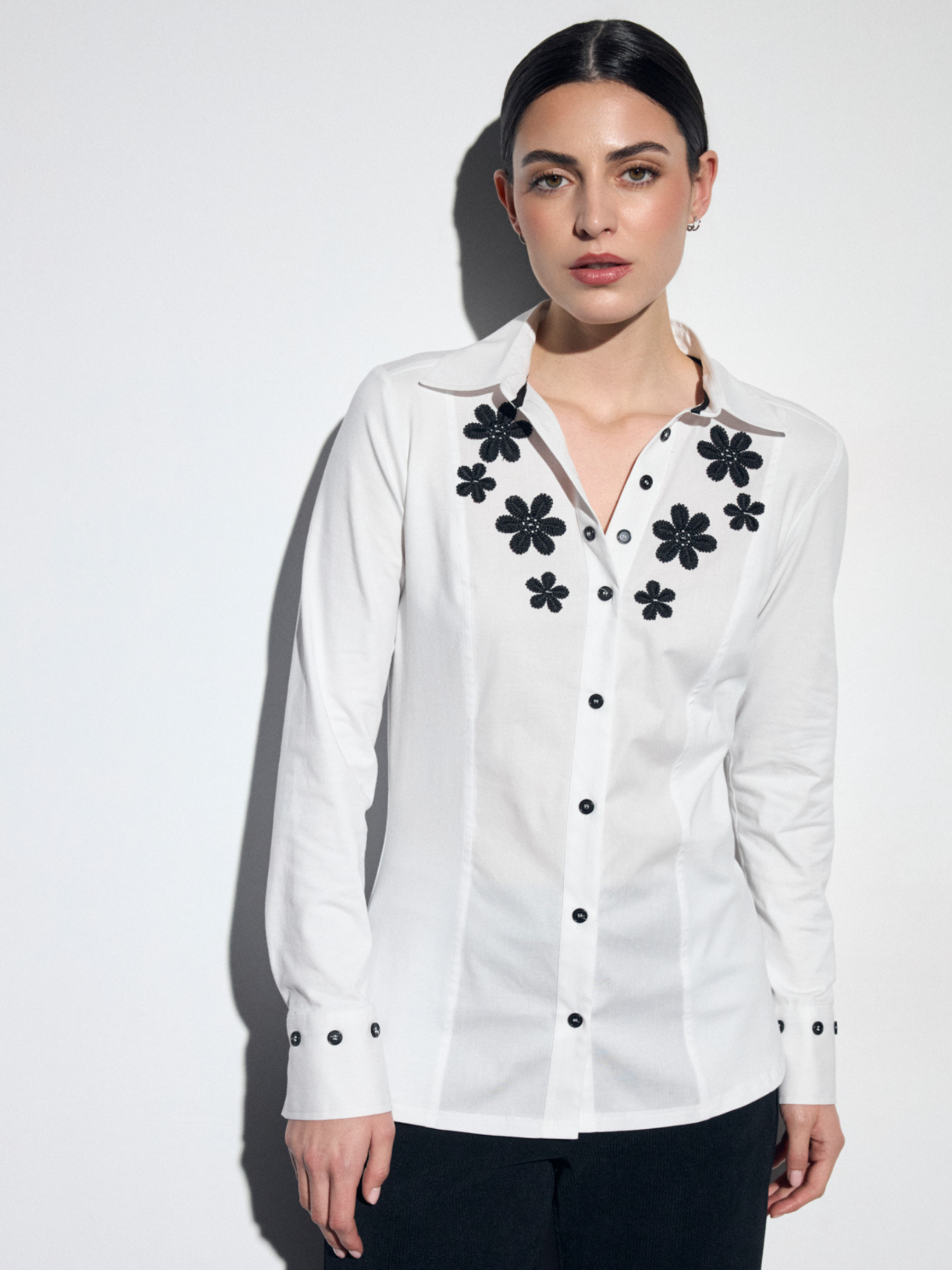Tinta Iva Shirt with collar neckline, button front, long sleeves and floral detail