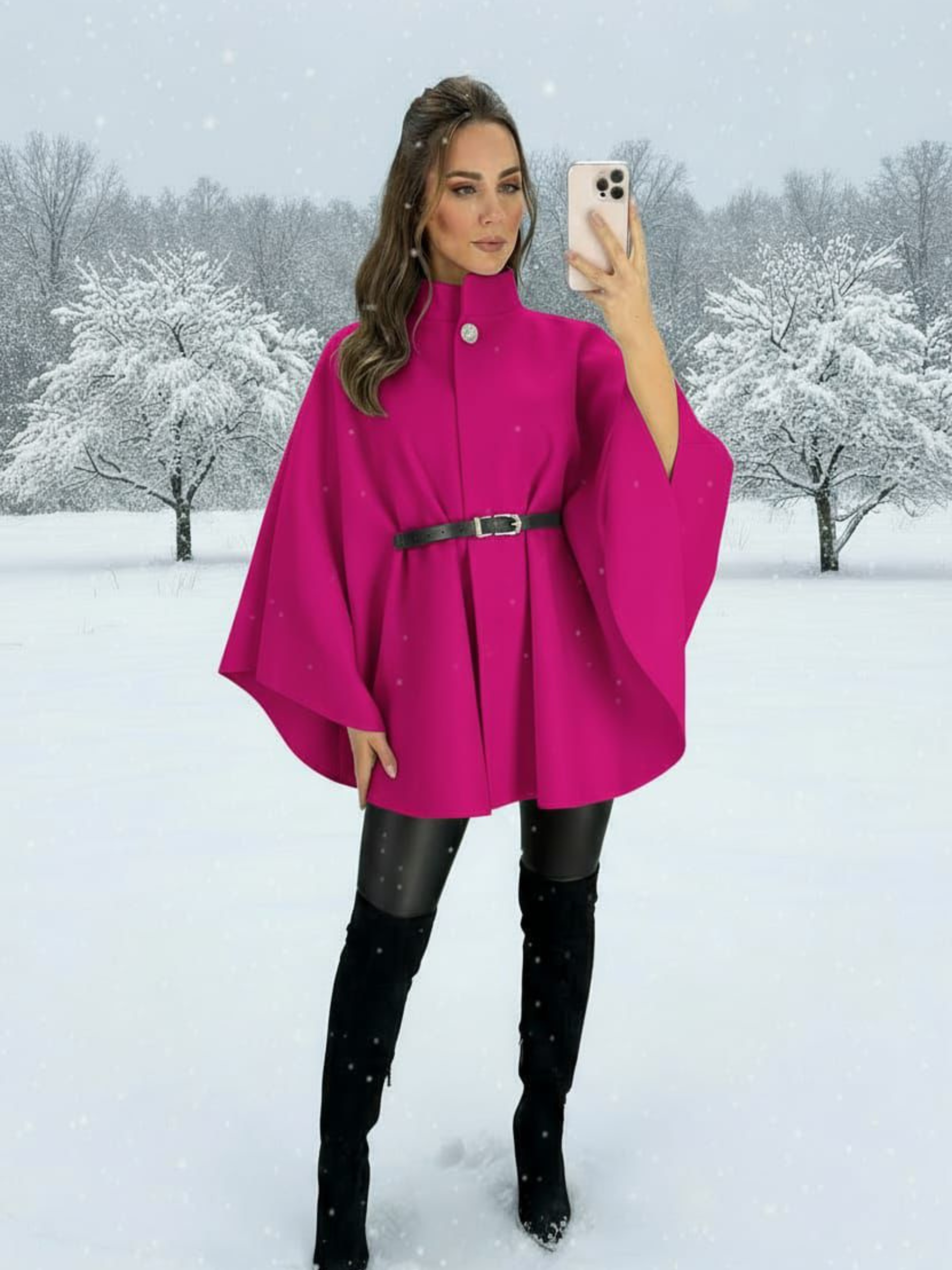 The QBAW25 RR Fuchsia Carrie Cape features a structured silhouette with wide sleeves, a high neckline and elegant gold button detailing. Finished with a detachable belt for a flattering fit, this chic cape blends timeless tailoring with modern sophistication - perfect for layering over seasonal outfits.