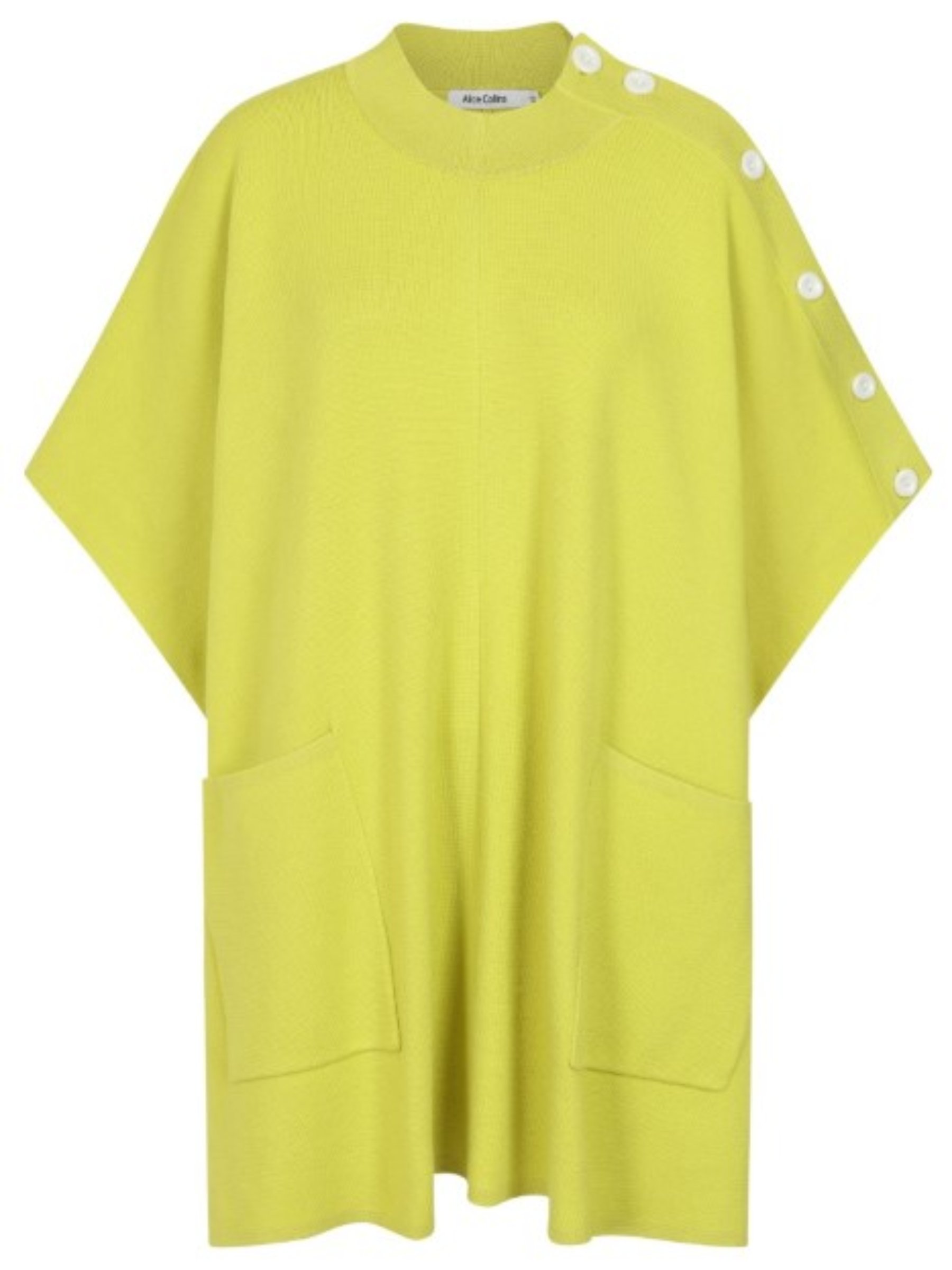 Cape by Alice Collins featuring button detailing on the shoulder, patch pockets, and a high neckline – soft lightweight knit ideal for layering and casual everyday wear.