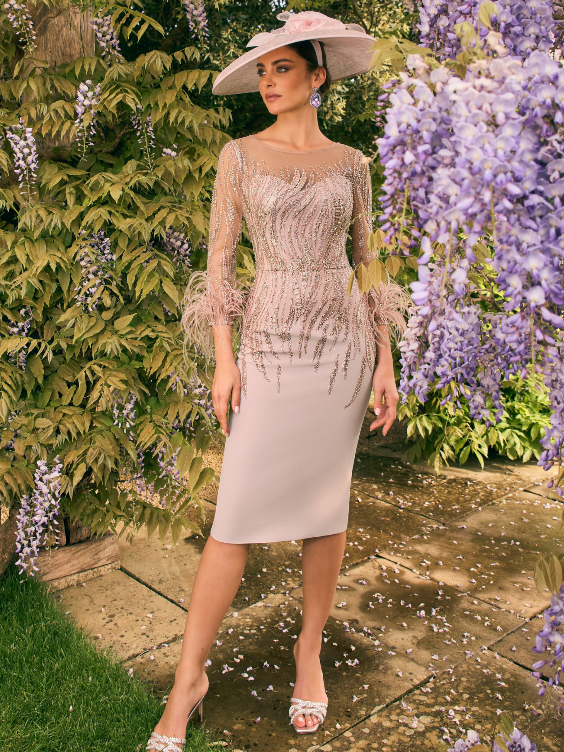Veni Infantino 992707 Almond Dress – almond crepe occasion dress with beaded tulle, illusion neckline, embellished long sleeves and feather cuffs. Perfect for Mother of the Bride or Groom.