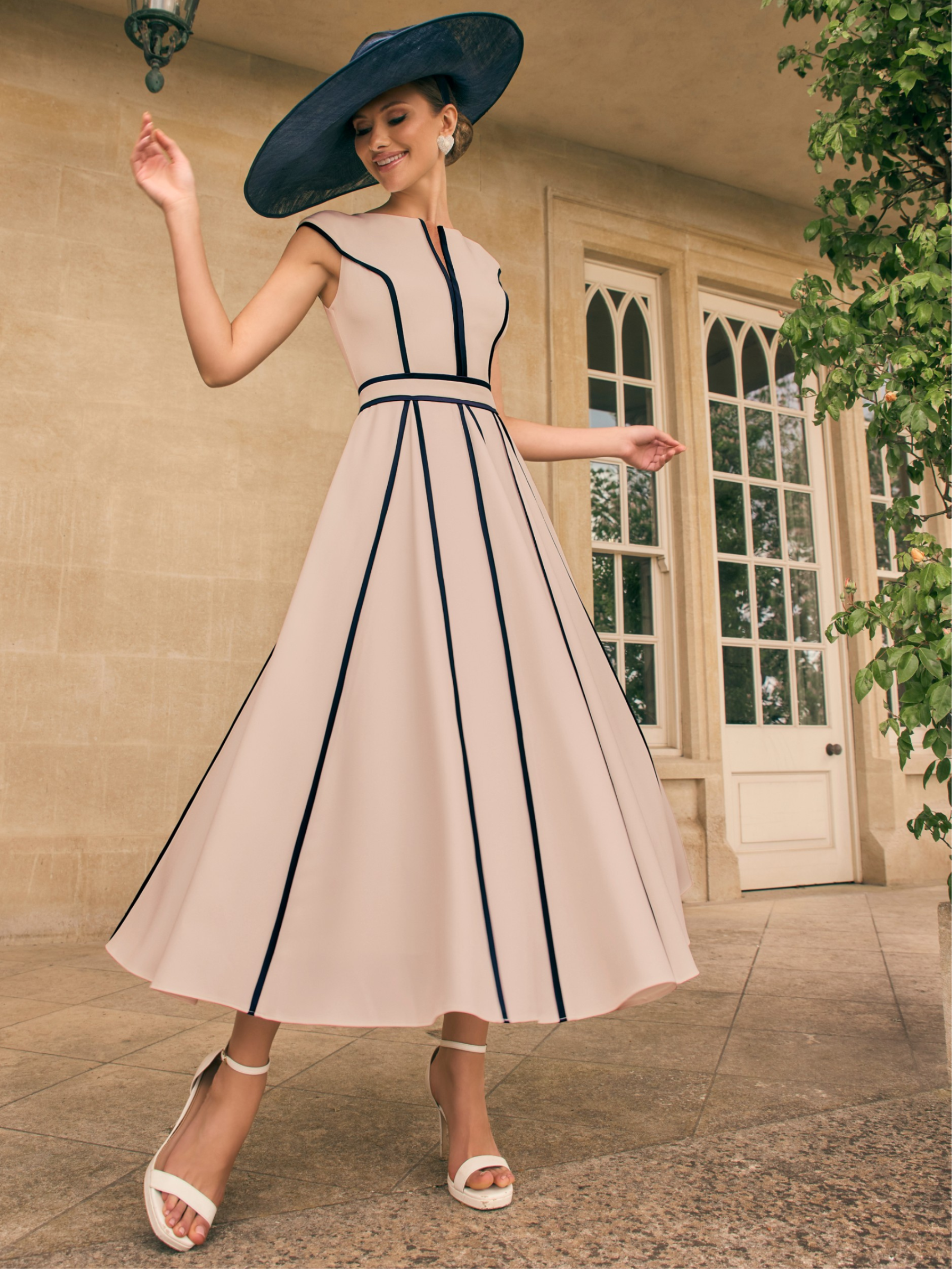 Veni Infantino 992711 Navy/Almond Dress & Jacket with contrast navy panel detailing and satin-trim floral appliqué jacket. Elegant A-line midi dress set for weddings and special occasions.