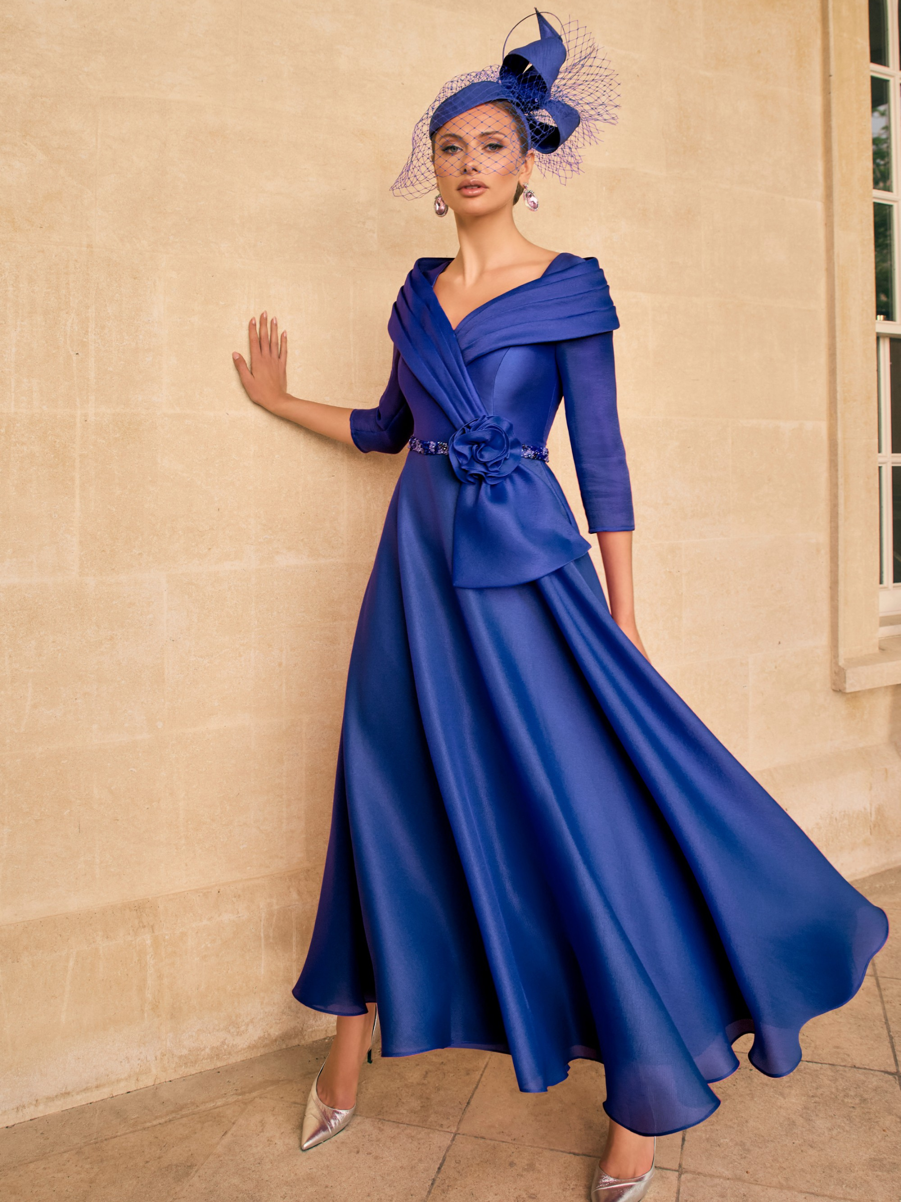 Veni Infantino 992720A Royal Blue Dress with pleated V-neck collar, ¾ sleeves, beaded trim and flared A-line midi skirt. Elegant occasion dress ideal for weddings and formal events.