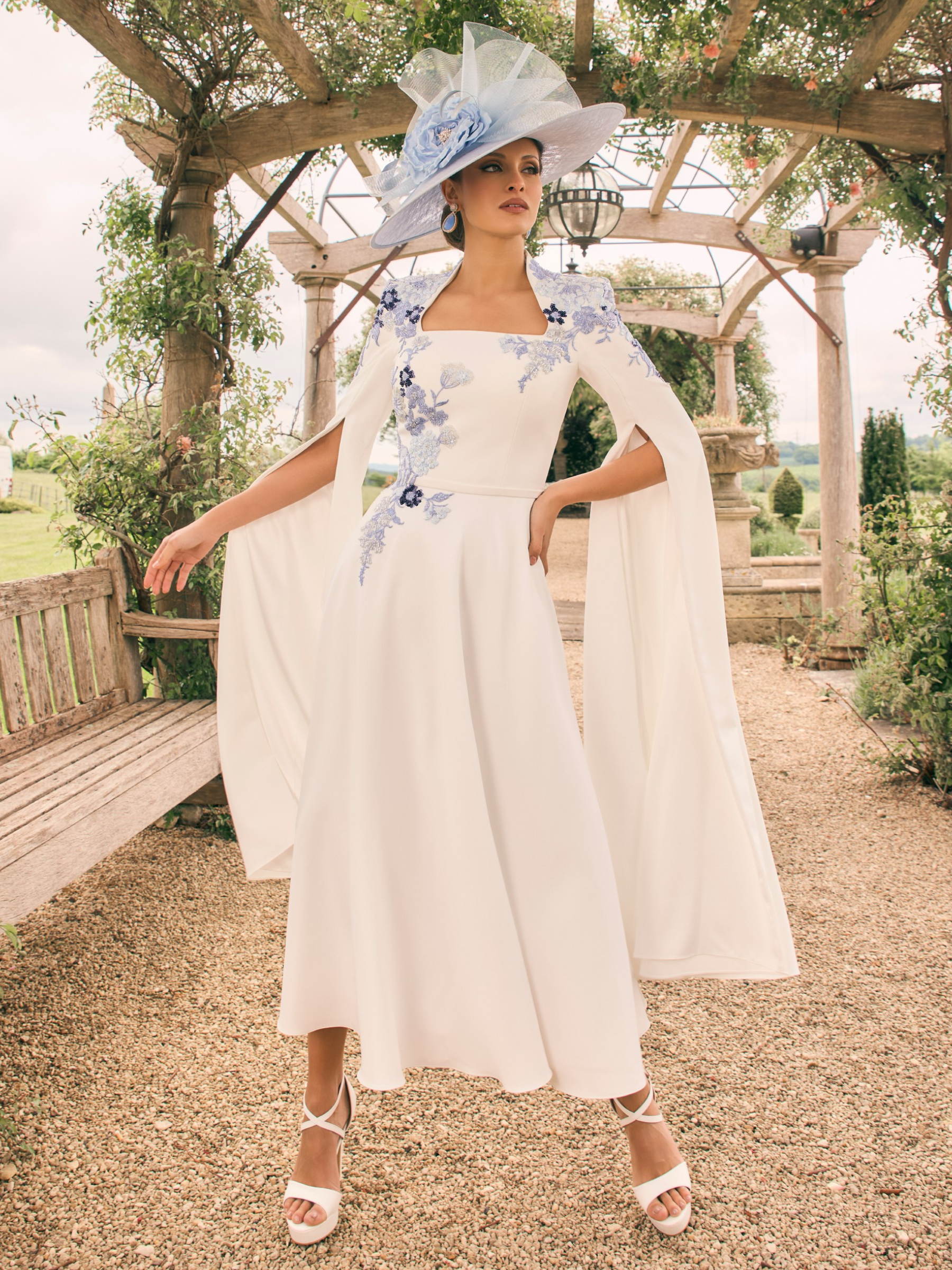 Veni Infantino 992722A Ivory/Pale Blue Dress with cape sleeves, square neckline and beaded lace appliqué details. A-line ivory dress with pale blue embroidery for weddings and special events.