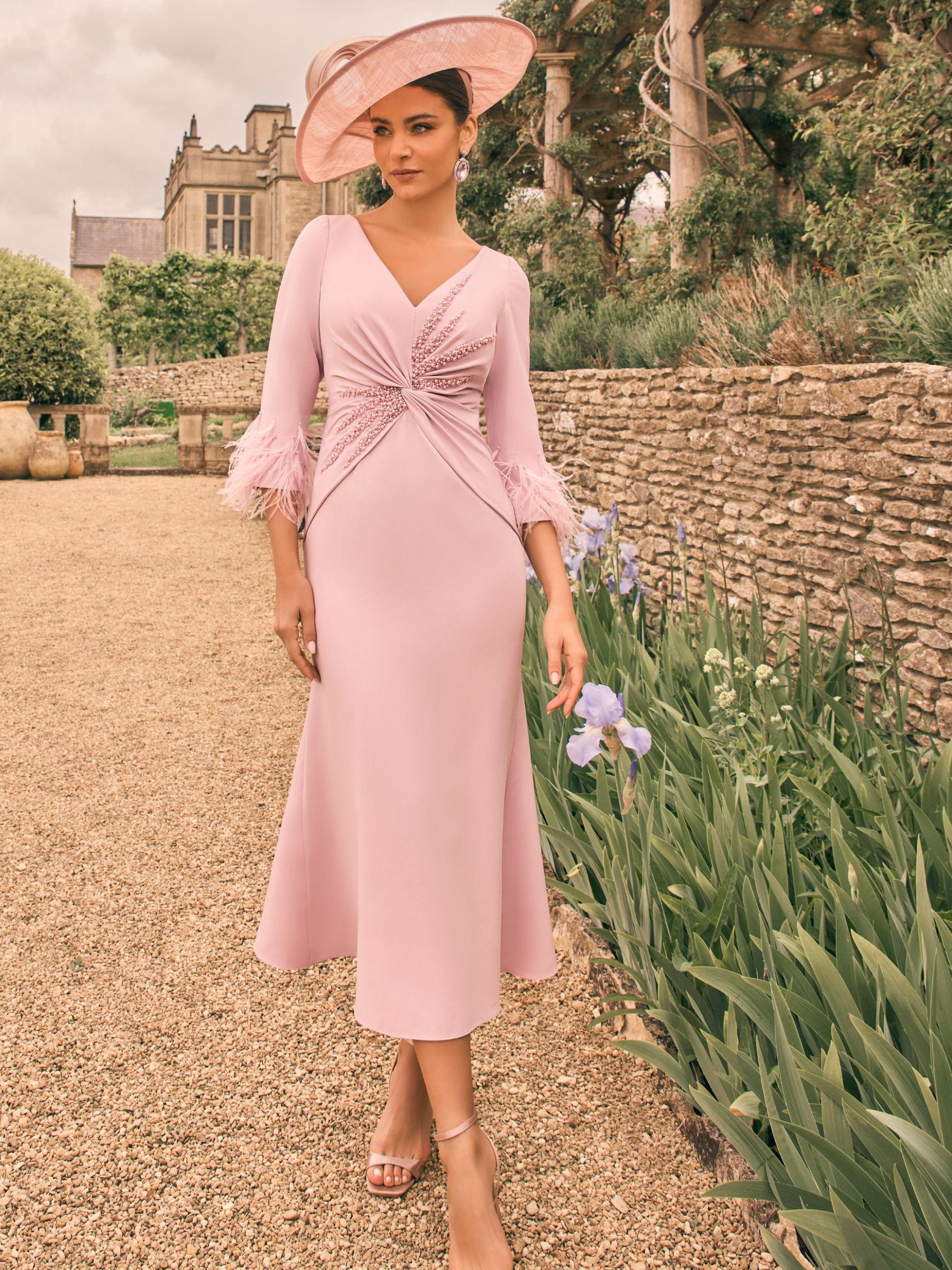  Veni Infantino 992729 Rose Dress with V-neckline, beaded waist trim, feather cuff sleeves and flared A-line midi skirt. Elegant occasion dress in soft crepe.