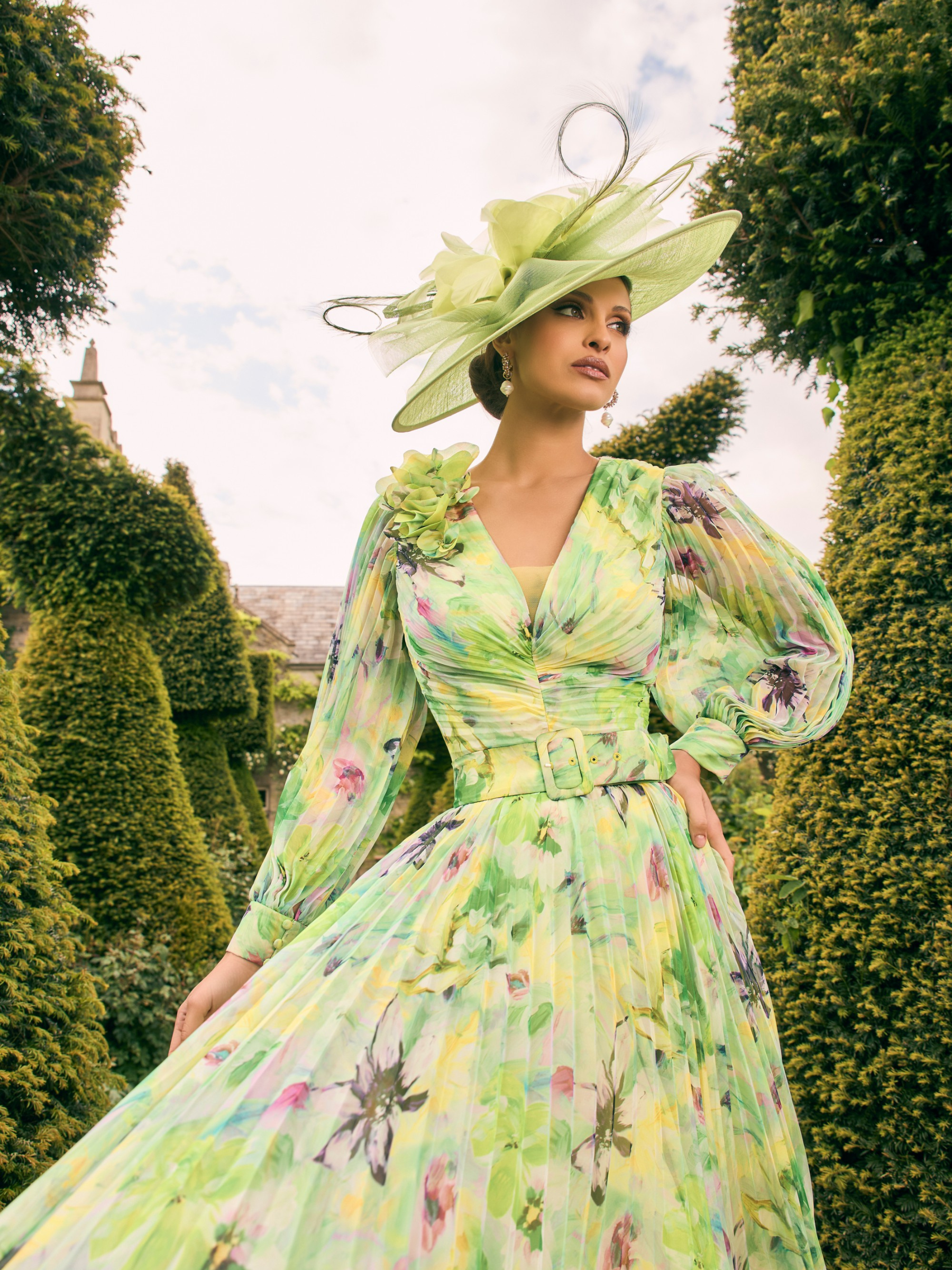 Veni Infantino 992770 Lime Multi Print pleated chiffon dress with wrap bodice, floral shoulder detail and matching belt. Elegant occasion wear perfect for weddings and special events.
