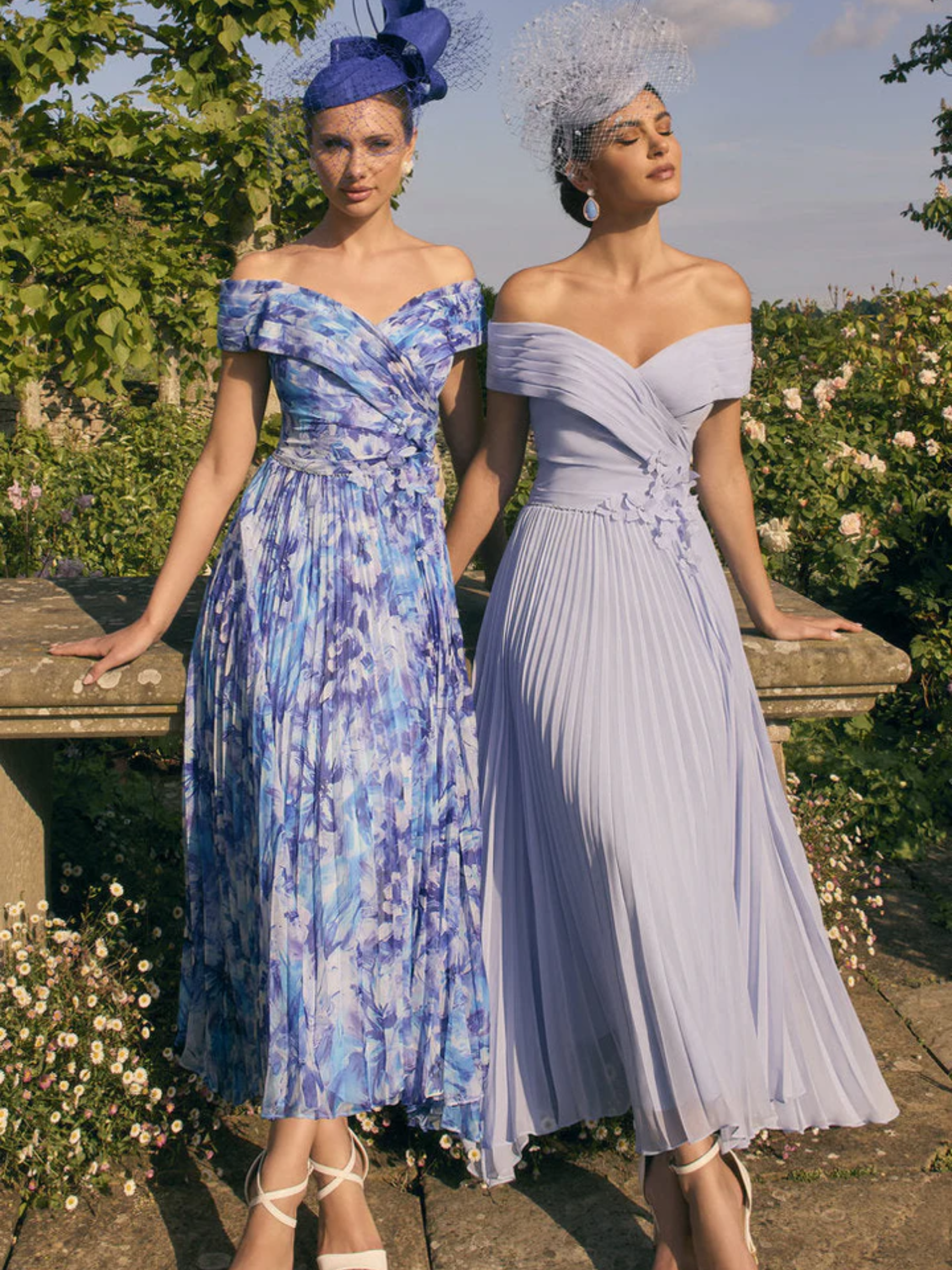 Veni Infantino 992779 Royal/Pale Blue Print Dress – off-the-shoulder printed chiffon occasion dress with pleated skirt and 3D floral appliqué waistband for weddings and race days.