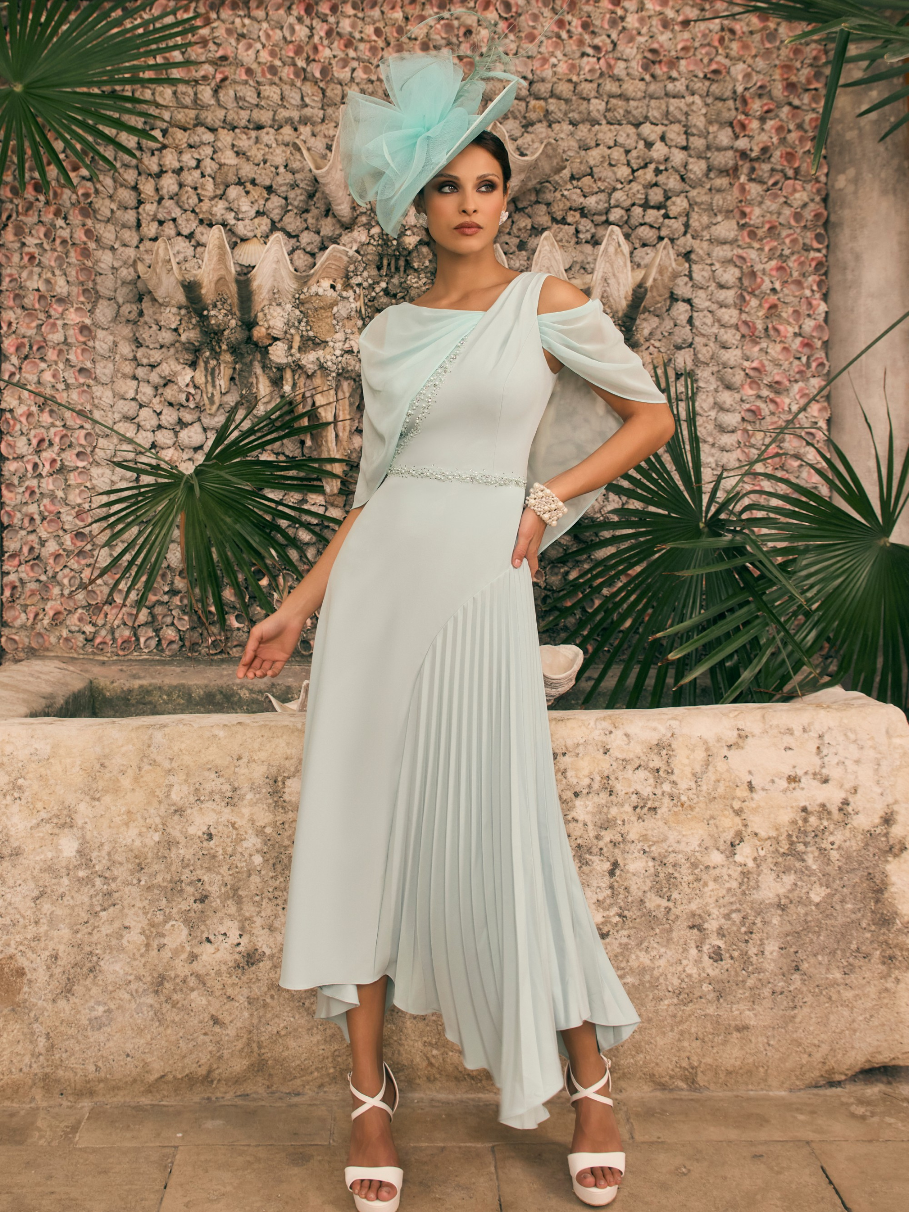 Veni Infantino 992785 Mint Dress – elegant mint asymmetric occasion dress with chiffon cape sleeves, pleated skirt and delicate beaded trim.