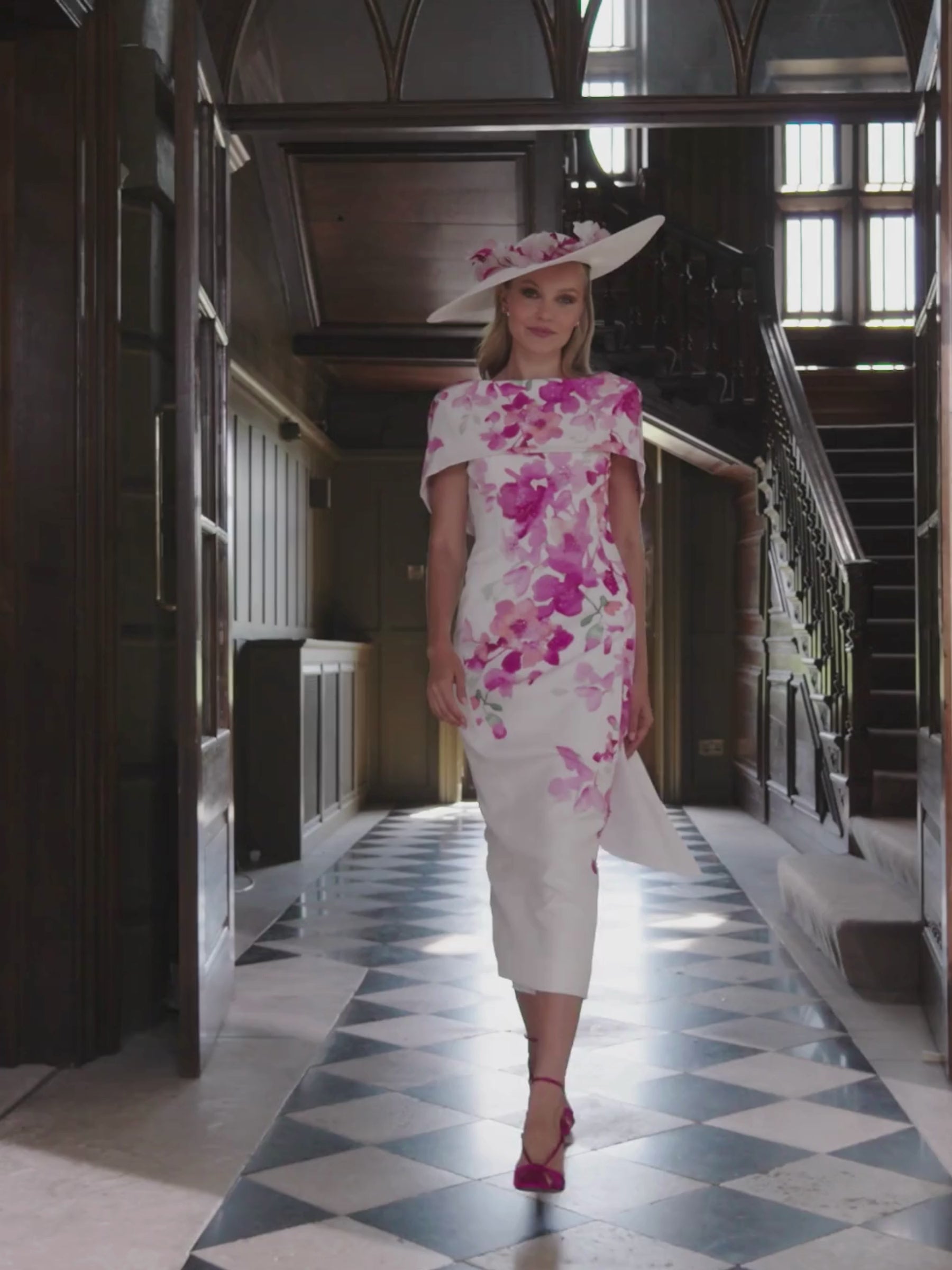 John Charles 66698 Petal Dress with floral crepe fabric, cape-style shoulder overlay and a sleek fitted silhouette — a romantic occasion dress ideal for weddings and elegant events.