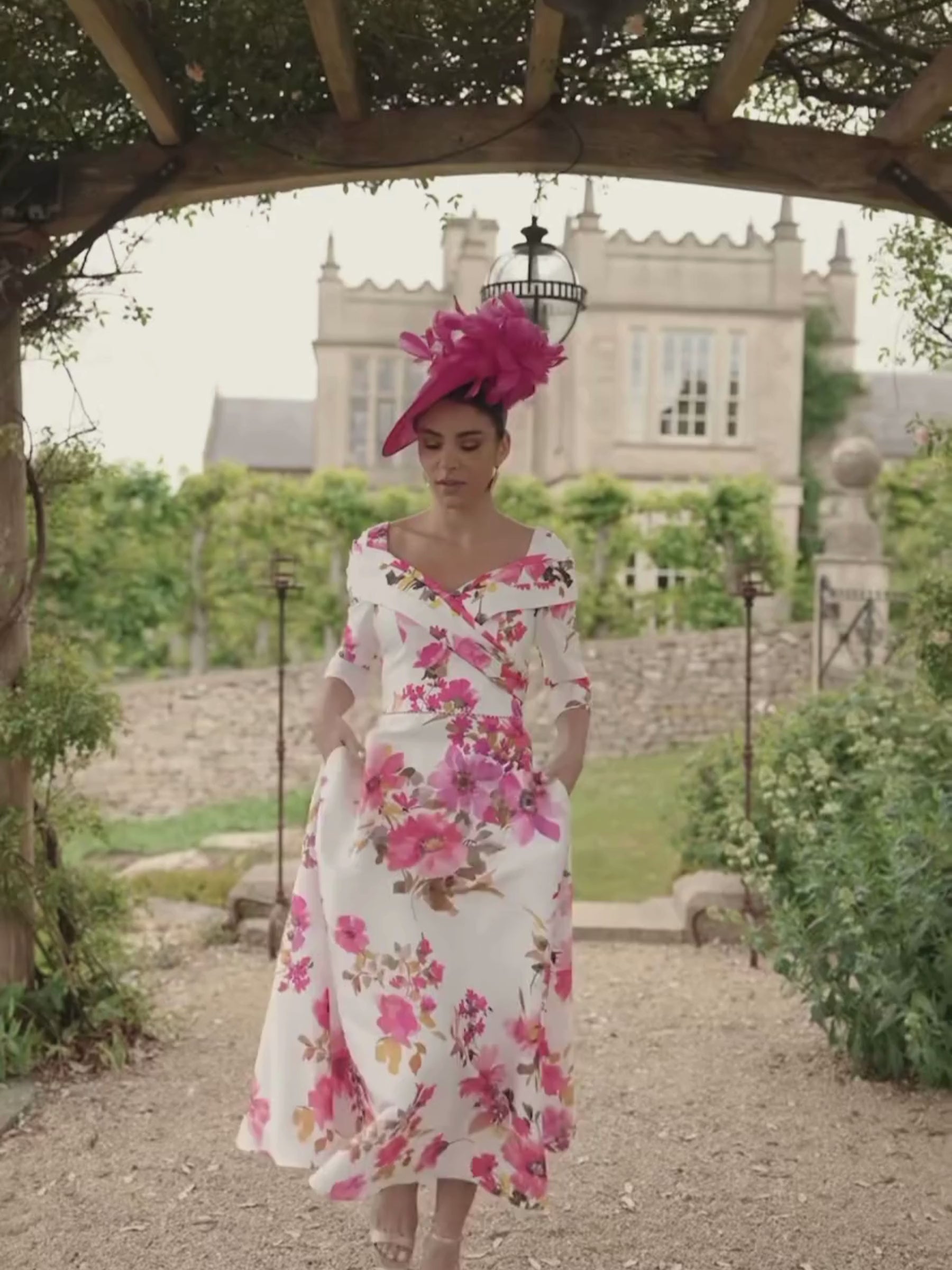 Veni Infantino 992733 Rosa Print Dress in mikado fabric with off-the-shoulder neckline and A-line midi skirt. Elegant floral occasion dress for weddings and special events.