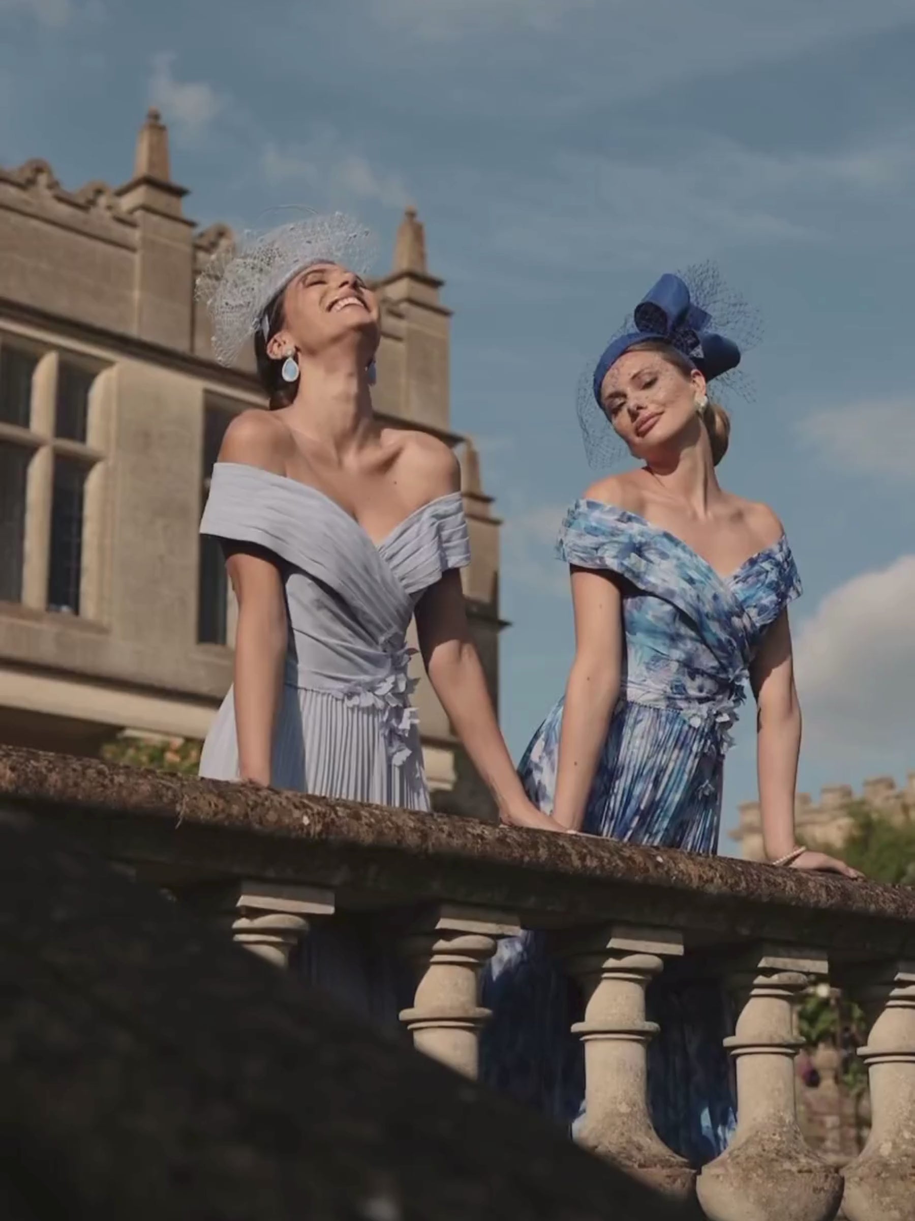 Veni Infantino 992779 Royal/Pale Blue Print Dress – off-the-shoulder printed chiffon occasion dress with pleated skirt and 3D floral appliqué waistband for weddings and race days.