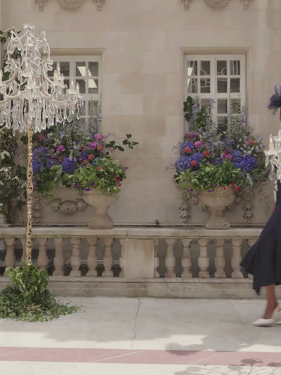 John Charles 29312 Navy/Ivory Dress with bardot neckline, chiffon appliqué, beaded detailing and fluted midi skirt.