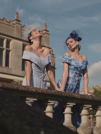 Veni Infantino 992779 Powder Blue Dress – elegant off-the-shoulder chiffon A-line occasion dress with pleated skirt and 3D floral applique detailing.