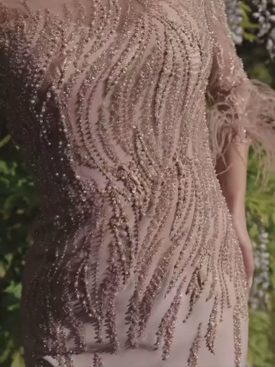 Veni Infantino 992707 Almond Dress – almond crepe occasion dress with beaded tulle, illusion neckline, embellished long sleeves and feather cuffs. Perfect for Mother of the Bride or Groom.