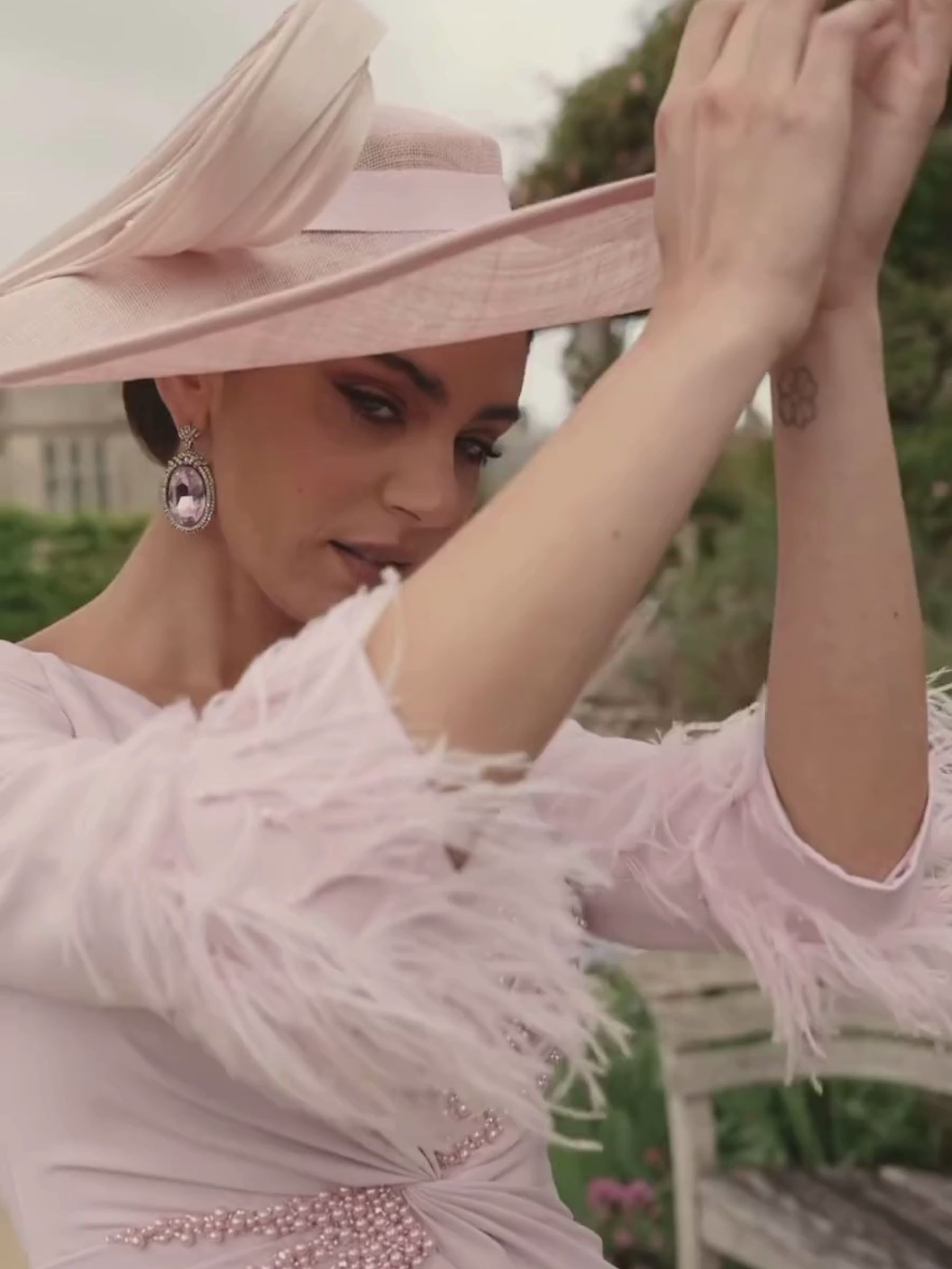  Veni Infantino 992729 Rose Dress with V-neckline, beaded waist trim, feather cuff sleeves and flared A-line midi skirt. Elegant occasion dress in soft crepe.