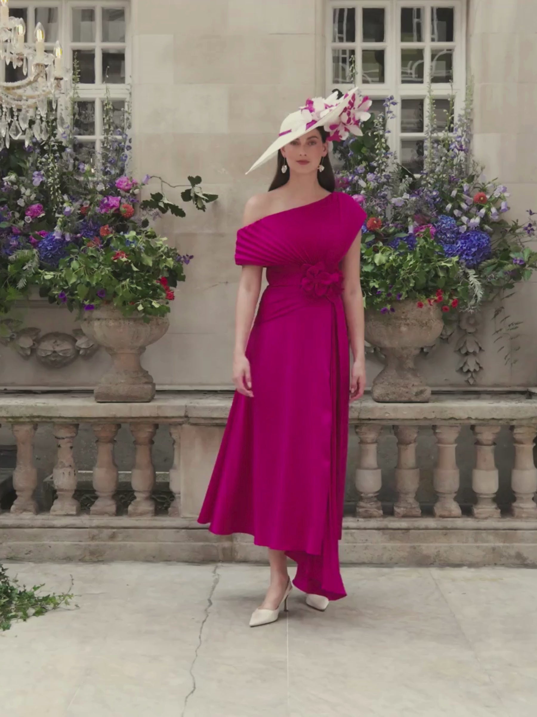 John Charles 66710 Ruby Pink Dress with asymmetric neckline, pleated bodice and asymmetrical A-line midi skirt with plissé godet.